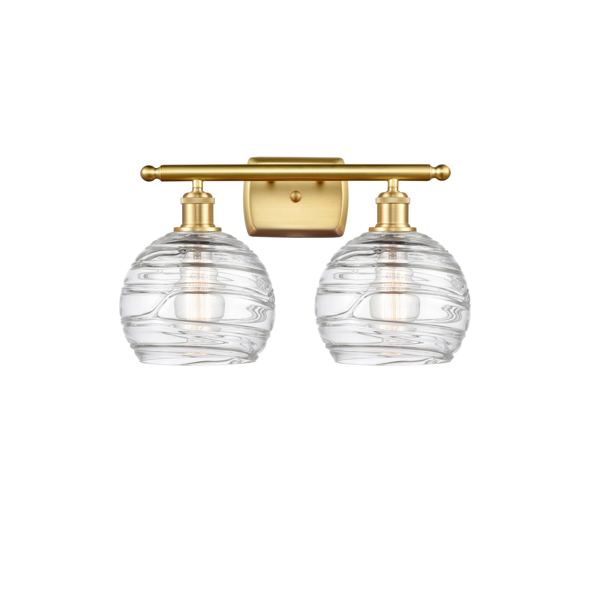 Shown in Satin Gold finish and Clear Deco Swirl glass