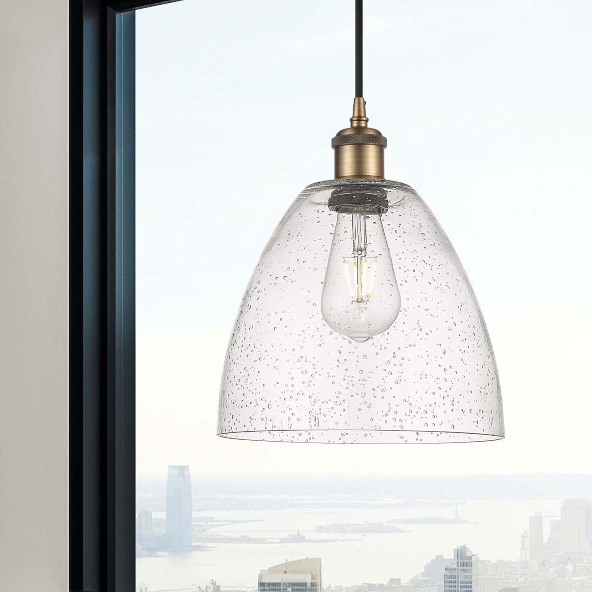 Shown in Brushed Brass finish and Seedy glass