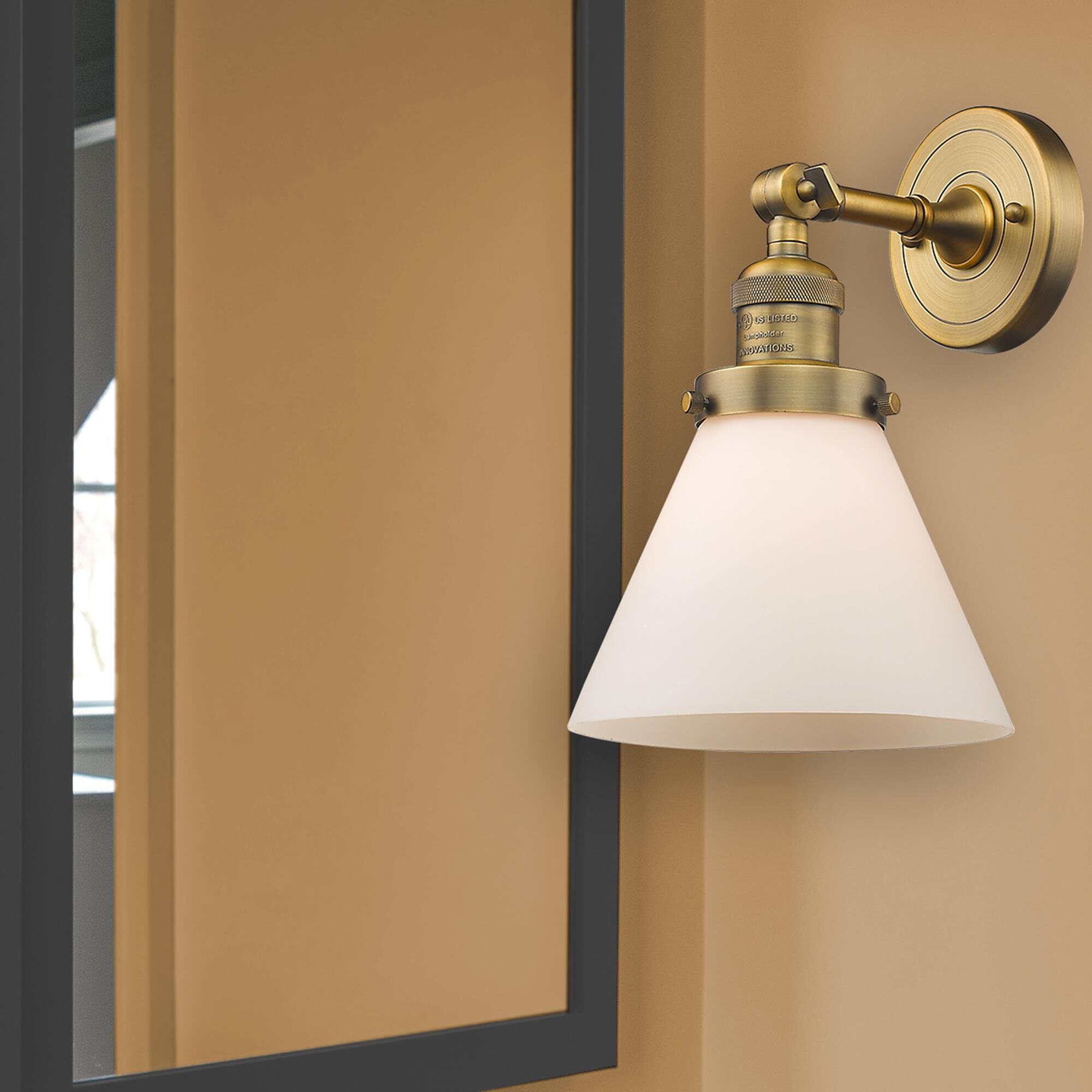 Shown in Brushed Brass finish and Matte White Cased glass