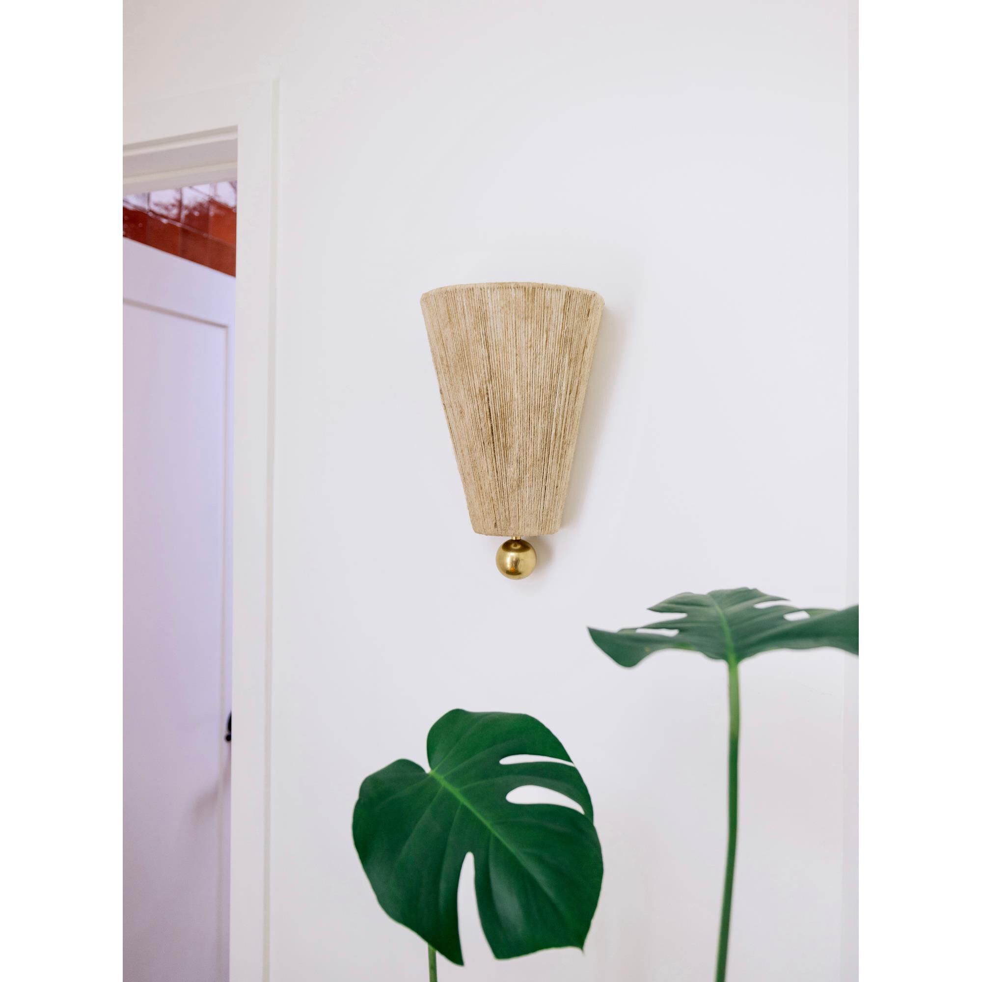 Shown in Aged Brass finish and Natural Woven shade