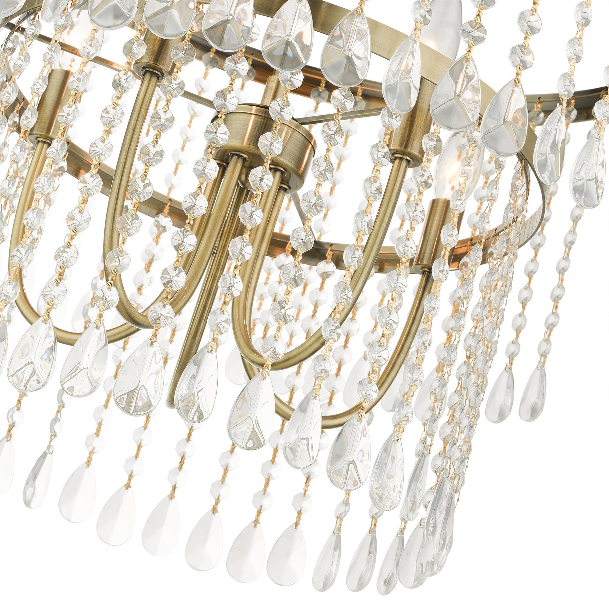 Shown in Antique Brass finish and Hand Assembled Crystal Shade glass
