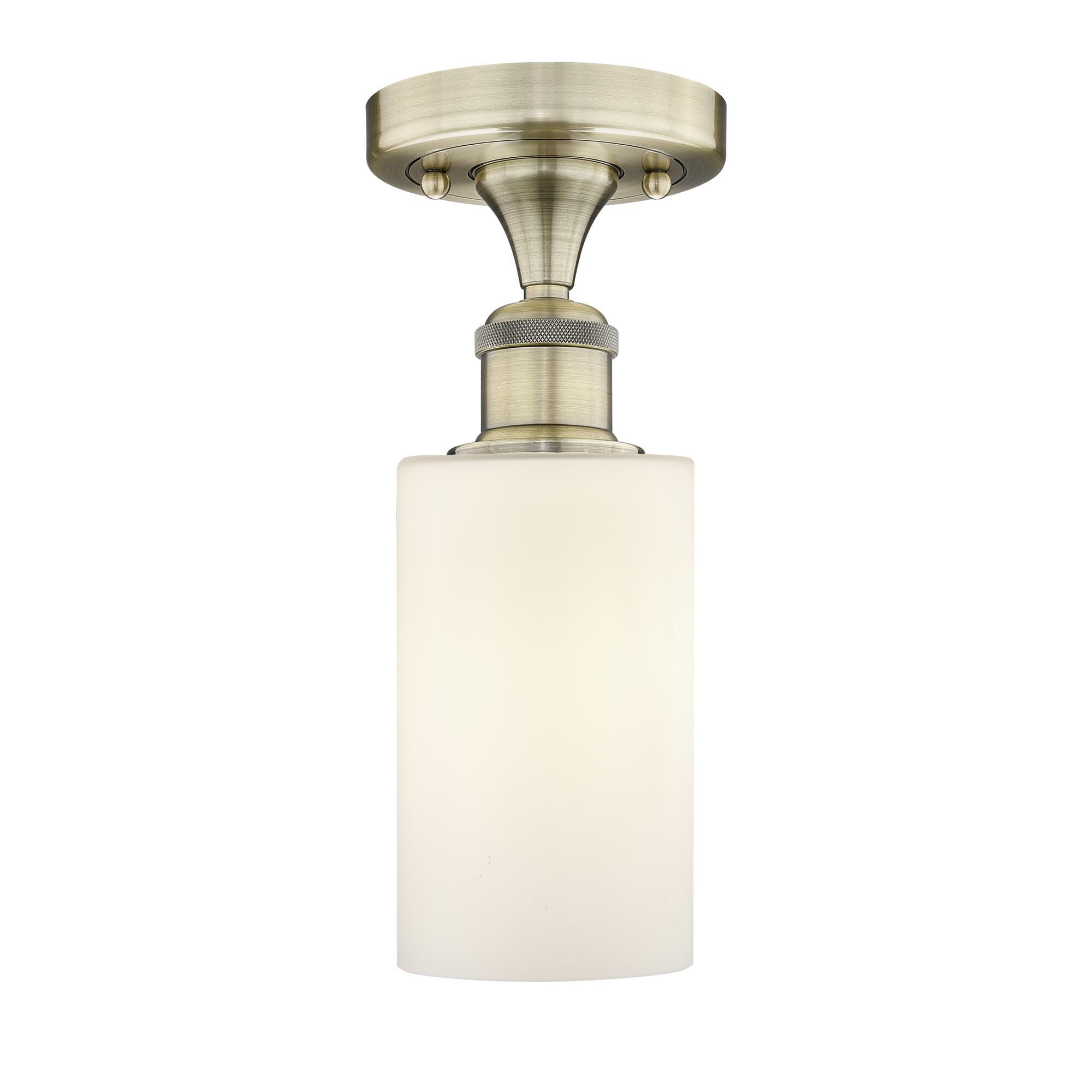 Shown in Antique Brass finish and Matte White glass