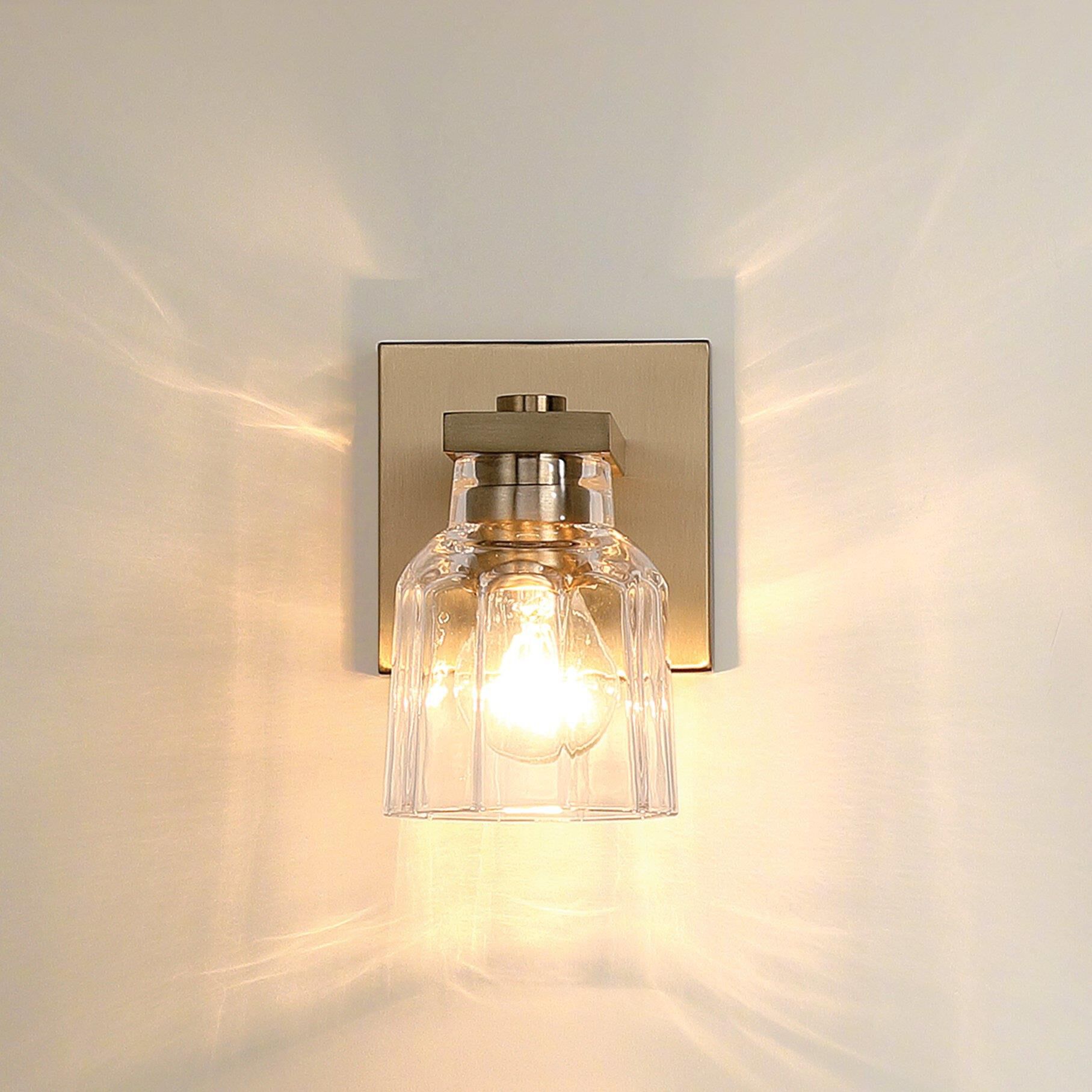 Shown in Champagne Gold finish and Clear Ribbed glass