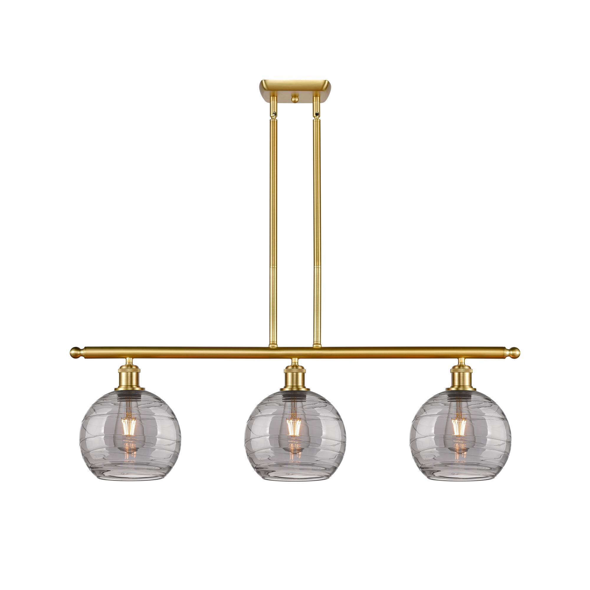 Shown in Satin Gold finish and Light Smoke Deco Swirl glass