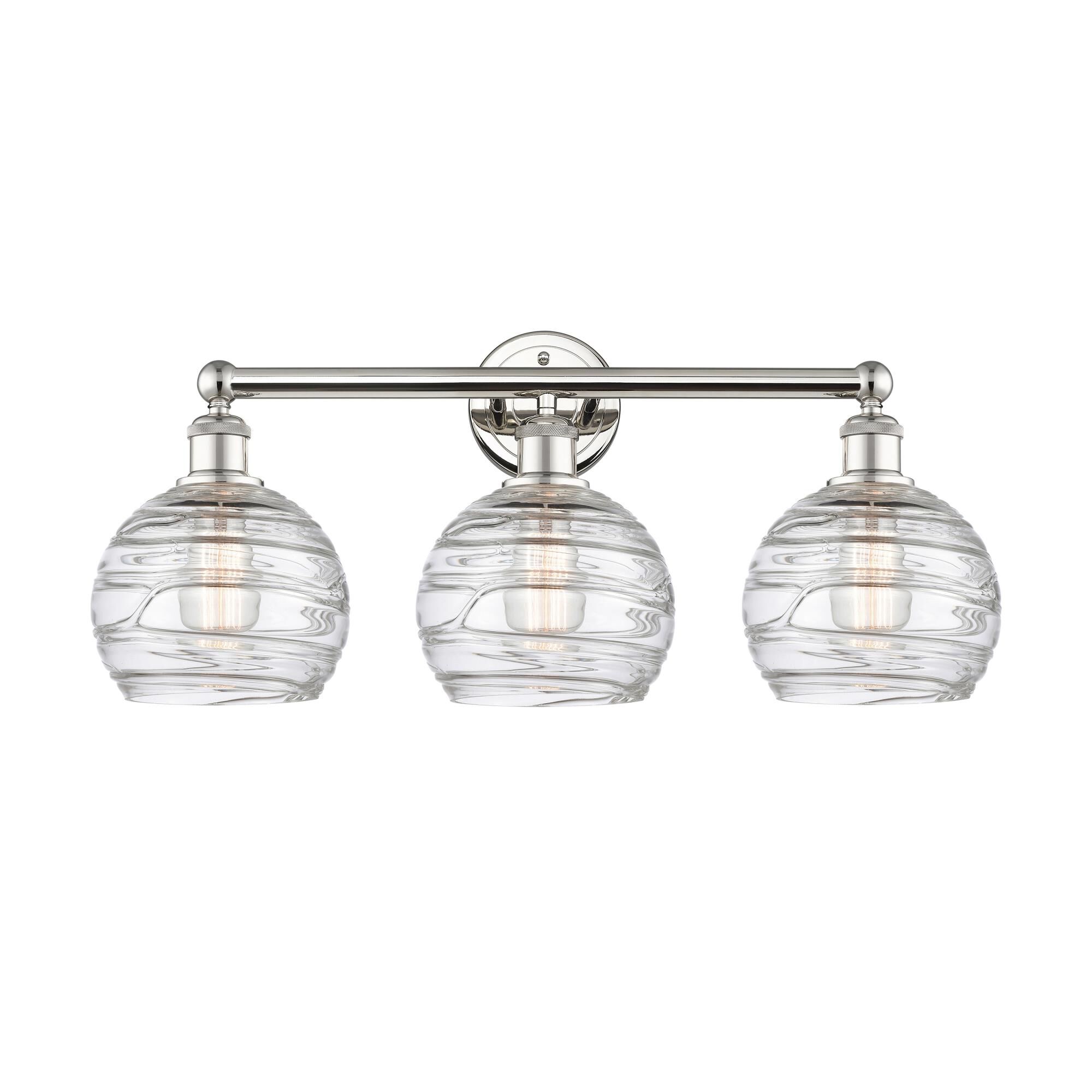 Shown in Polished Nickel finish and Clear Deco Swirl glass