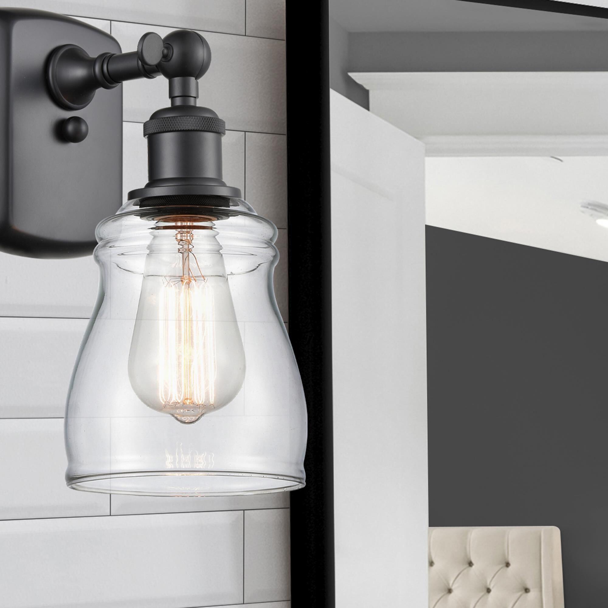 Shown in Matte Black finish and Transparent Clear Ellery glass and Glass shade and Bulb Tint - Amber accent