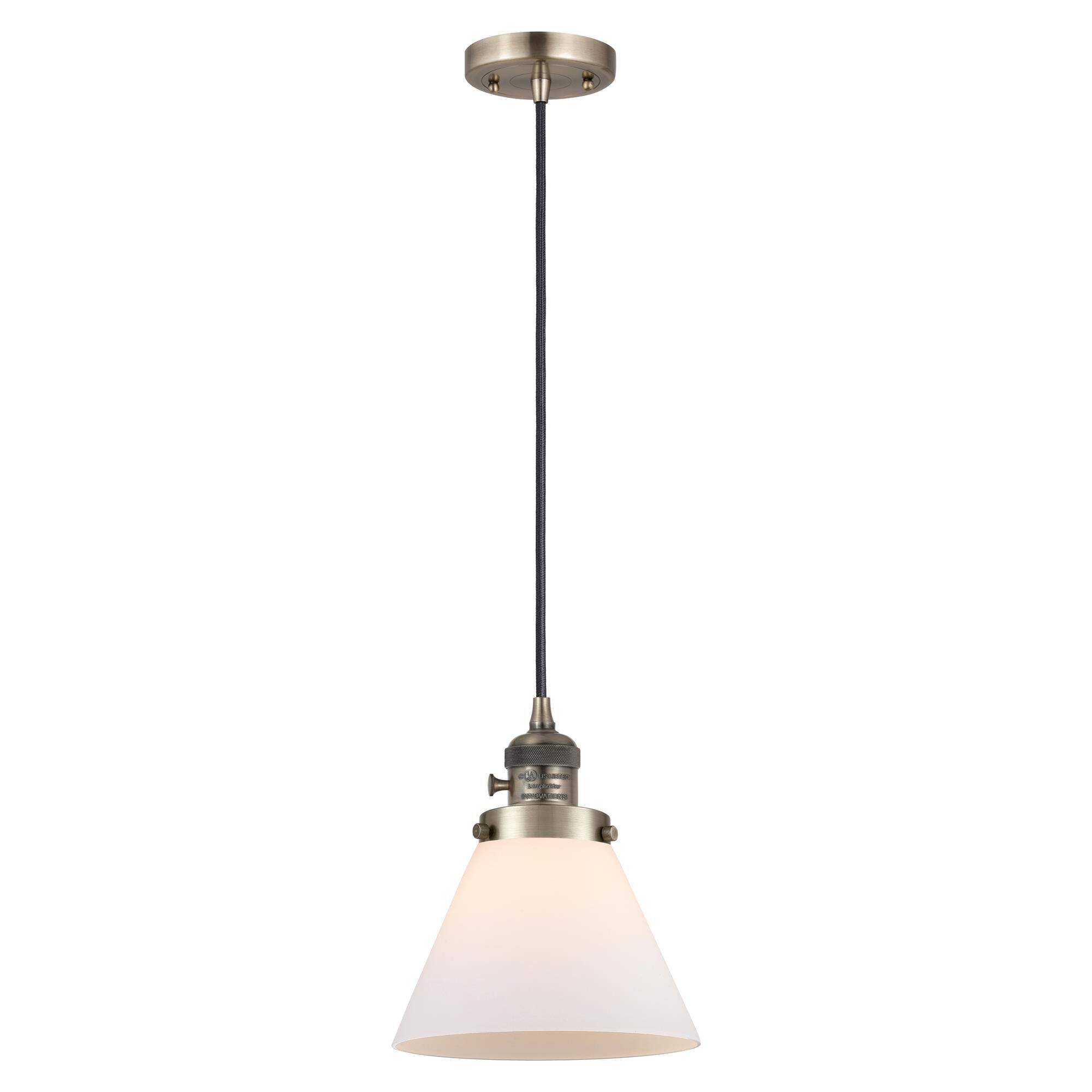 Shown in Antique Brass finish and Matte White glass
