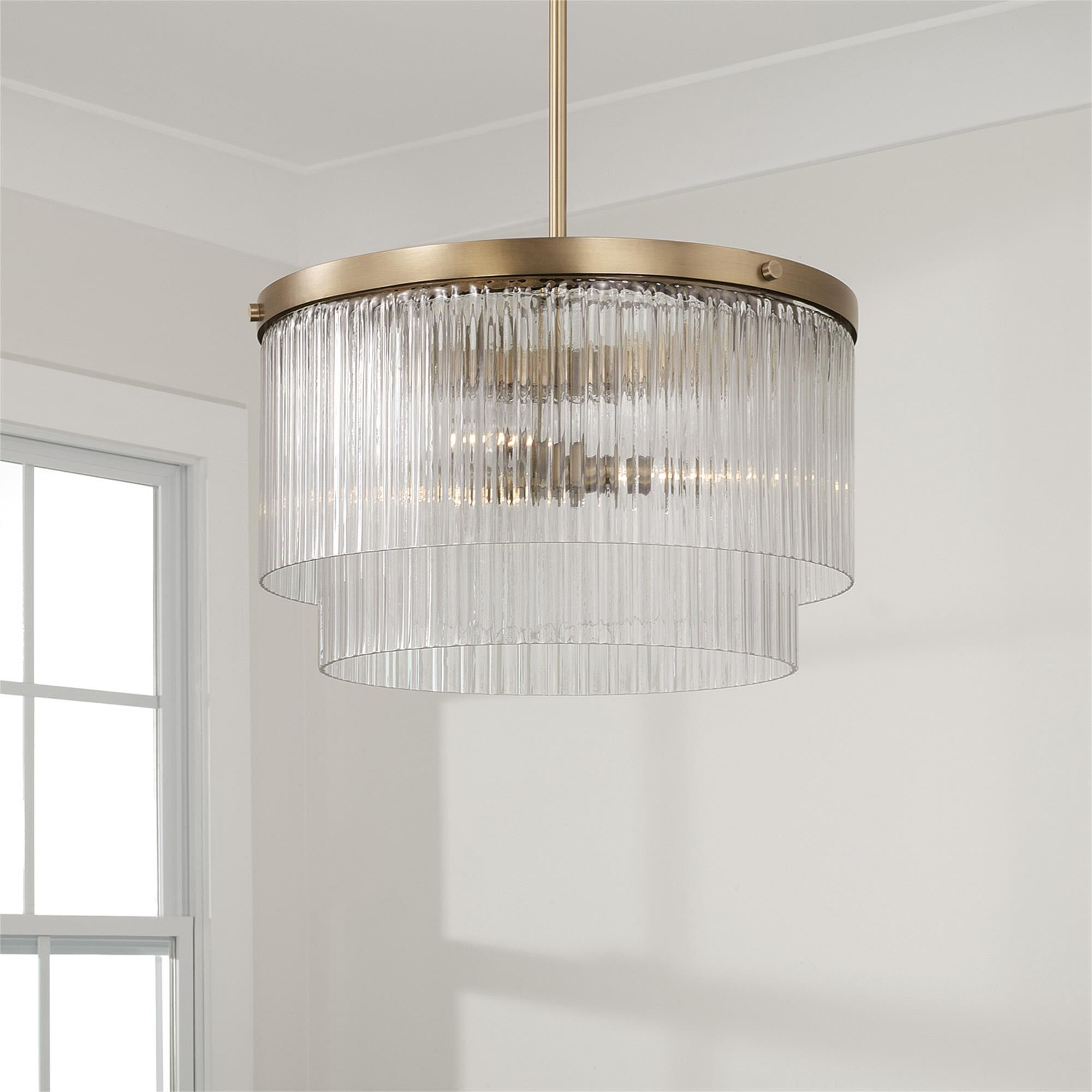 Shown in Aged Brass finish and Beveled Fluted glass