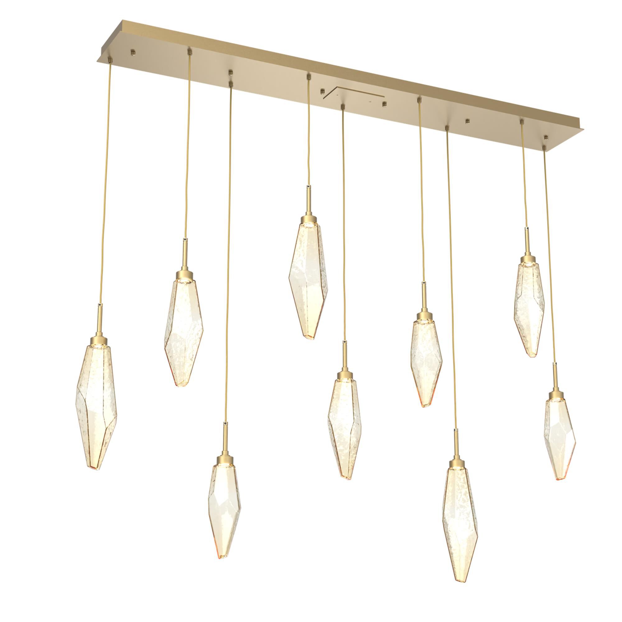 Shown in Gilded Brass finish and Chilled Amber glass