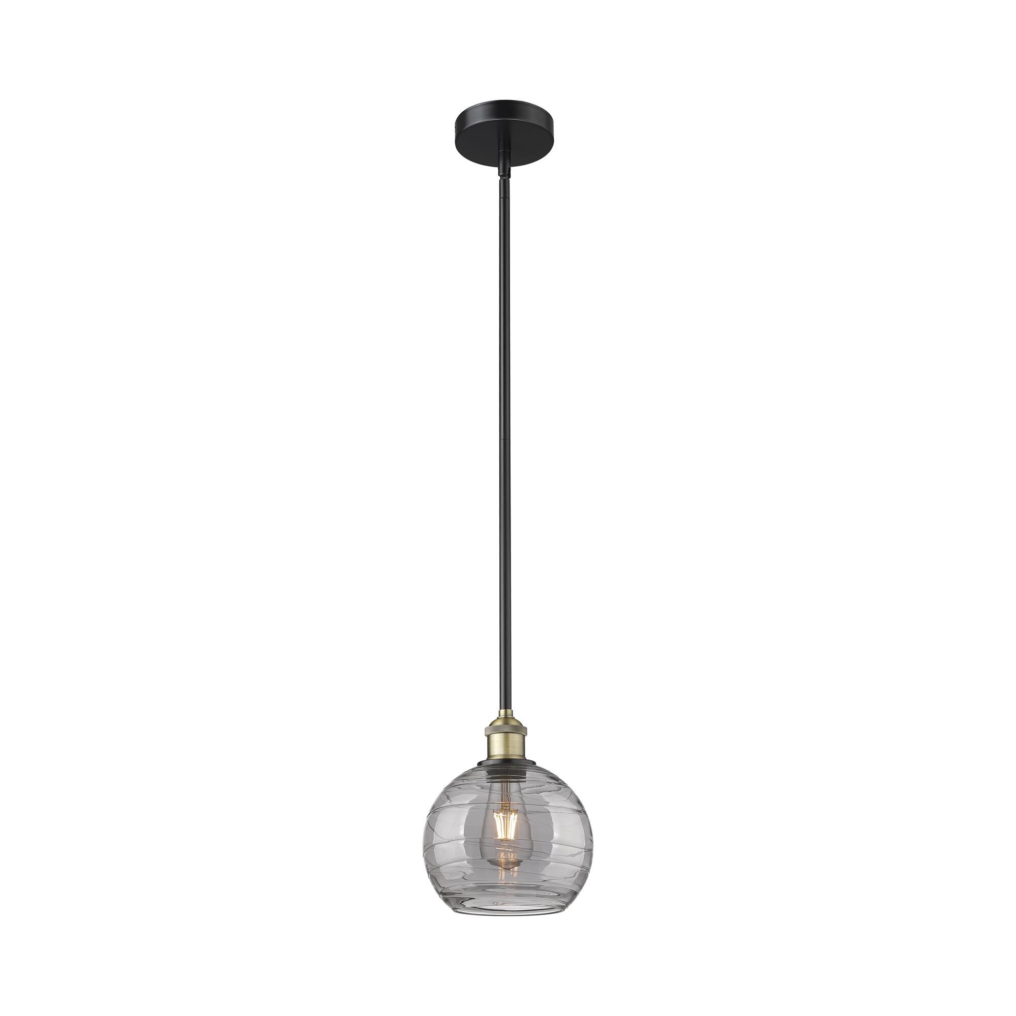 Shown in Black Antique Brass finish and Light Smoke Deco Swirl glass