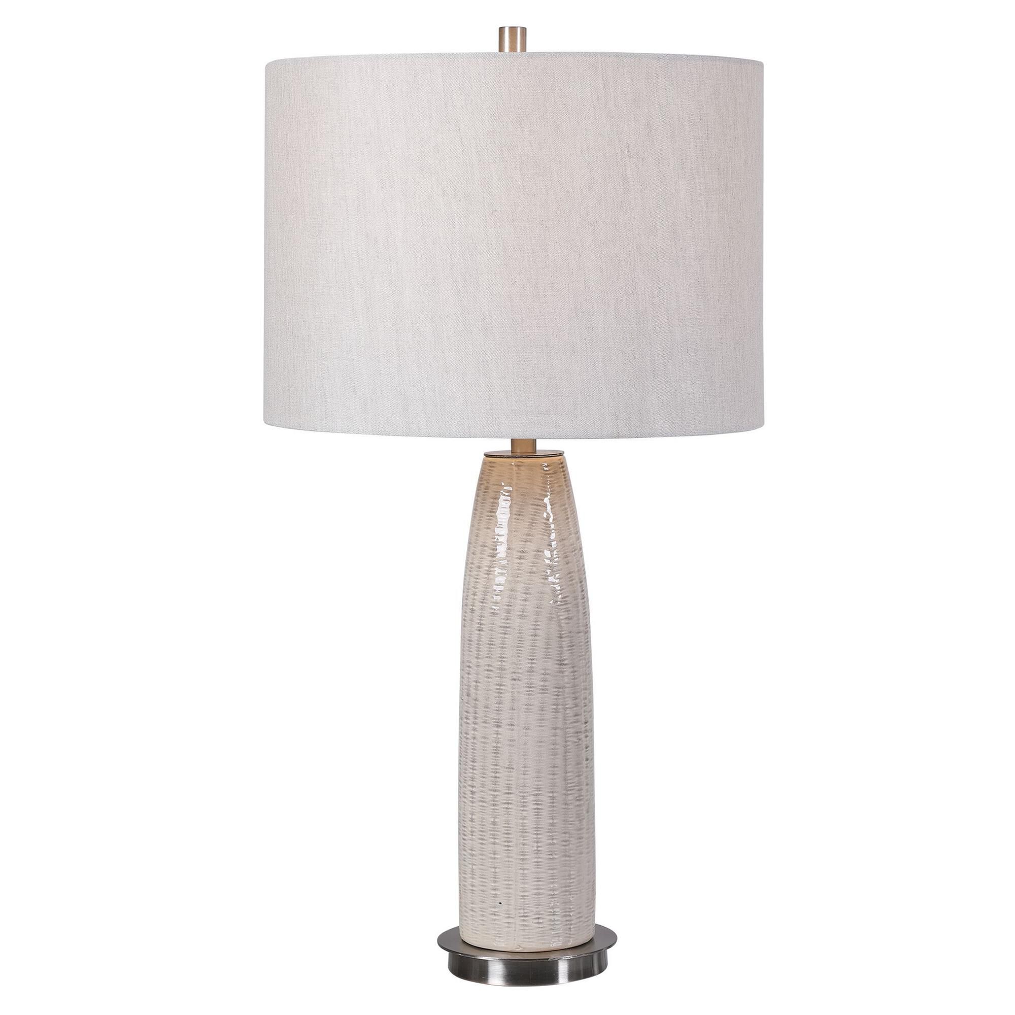 Shown in This Ceramic Base Keeps It Simple Yet Upscale With A Fashionable Pattern Finished In A Distressed Li finish and Round Drum Hardback shade