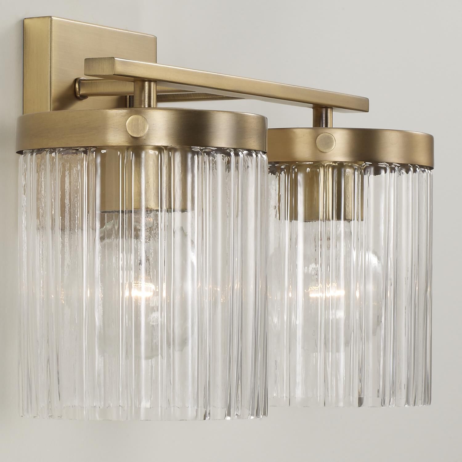 Shown in Aged Brass finish and Beveled Fluted glass