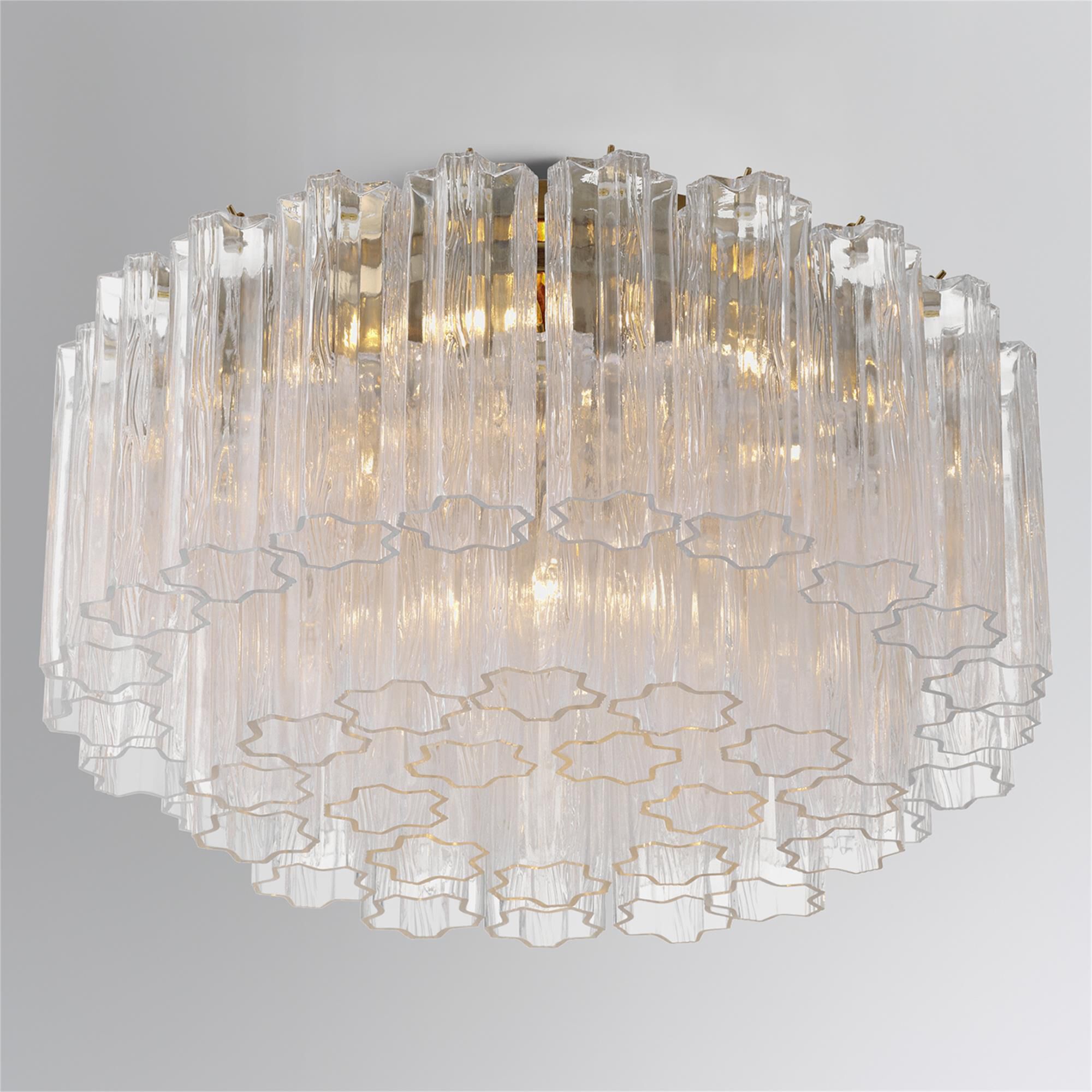 Shown in Aged Brass finish and Tronchi Clear glass