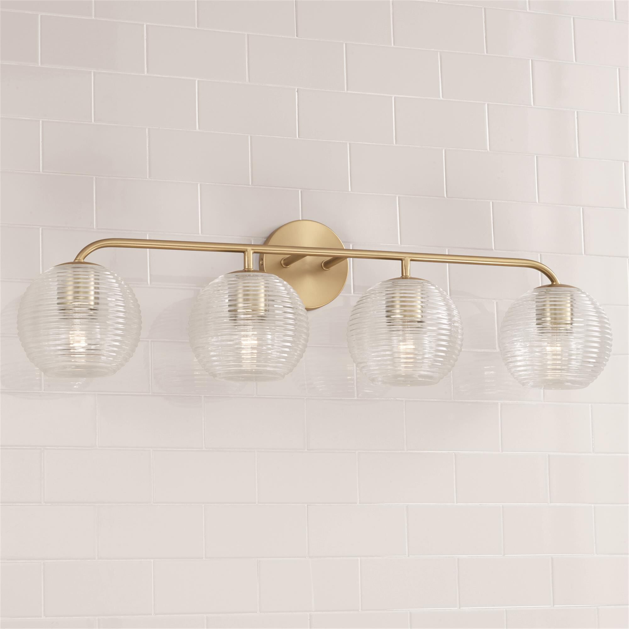 Shown in Matte Brass finish and Clear Ribbed glass