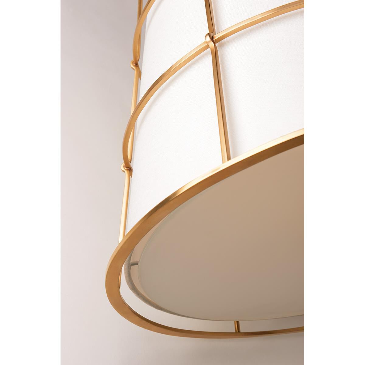 Shown in Aged Brass finish and Linen shade