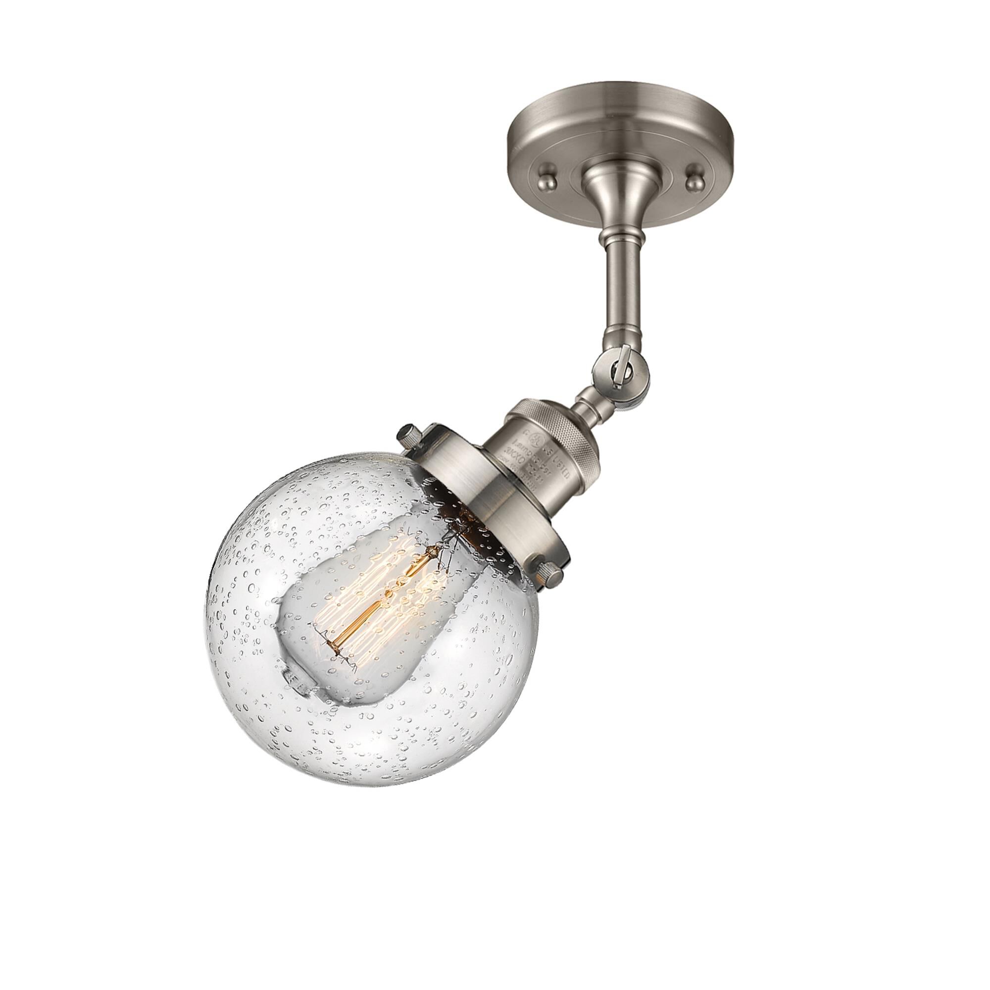 Shown in Brushed Satin Nickel finish and Seedy glass and No Accent accent