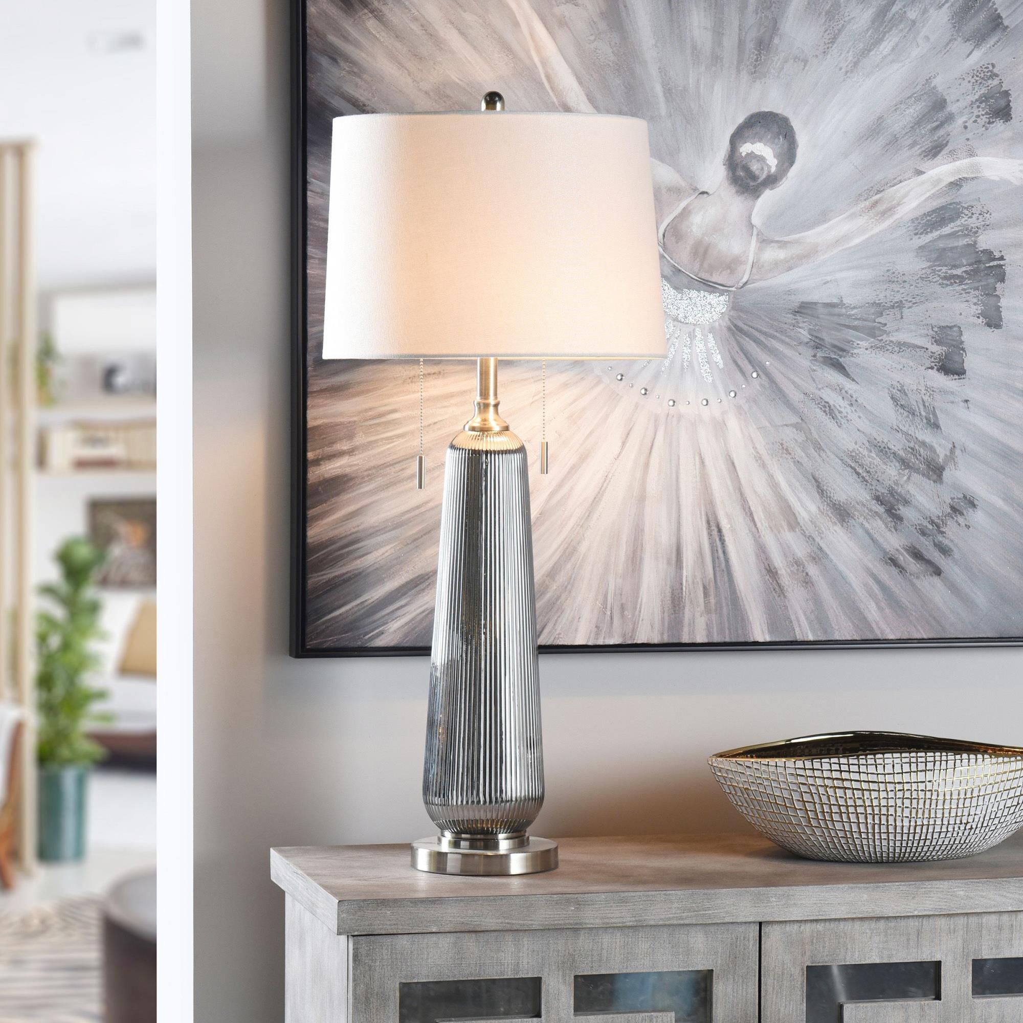 Shown in Silver Sateen, Polished Nickel, Off-White finish and Off-White Linen shade