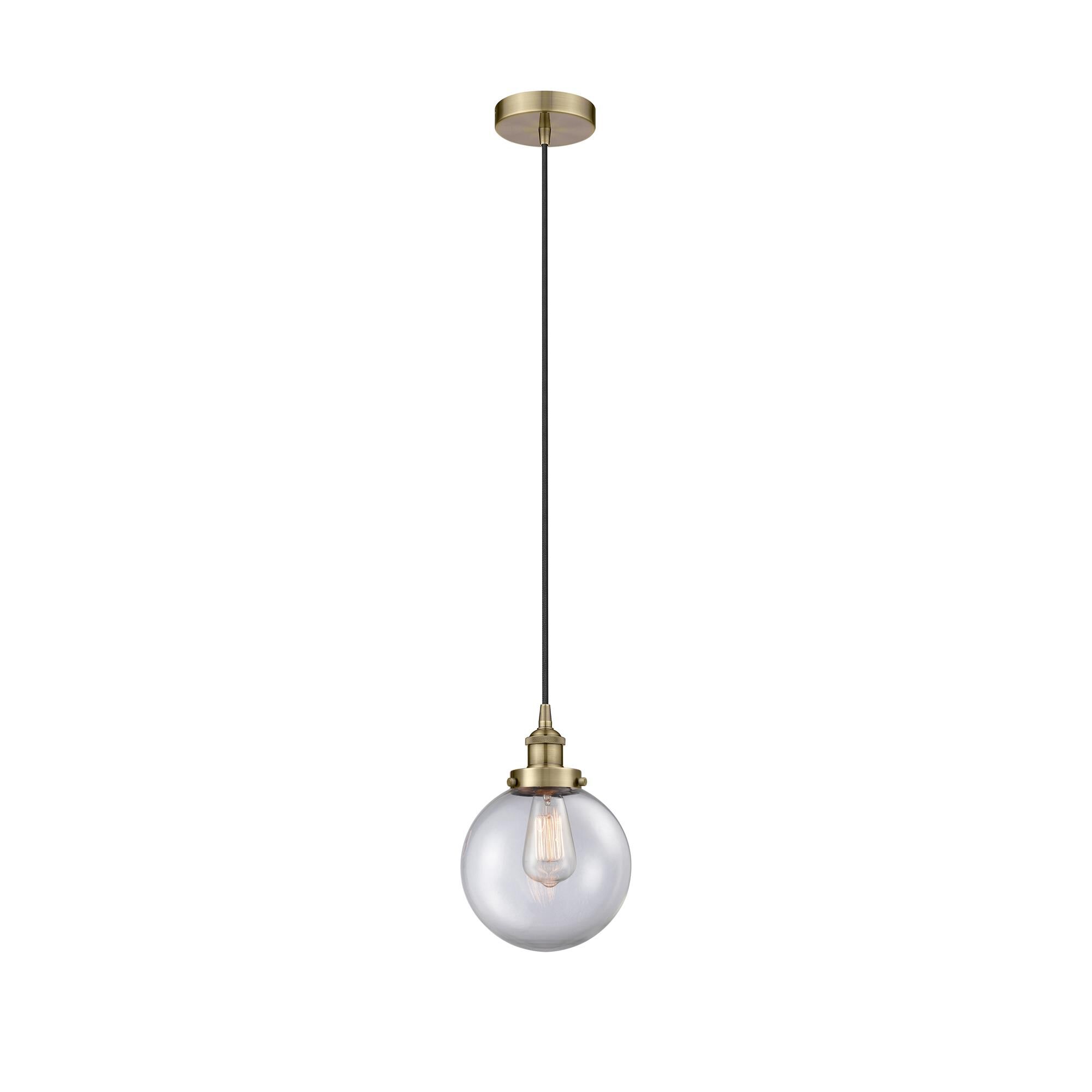 Shown in Antique Brass finish and Clear Beacon glass