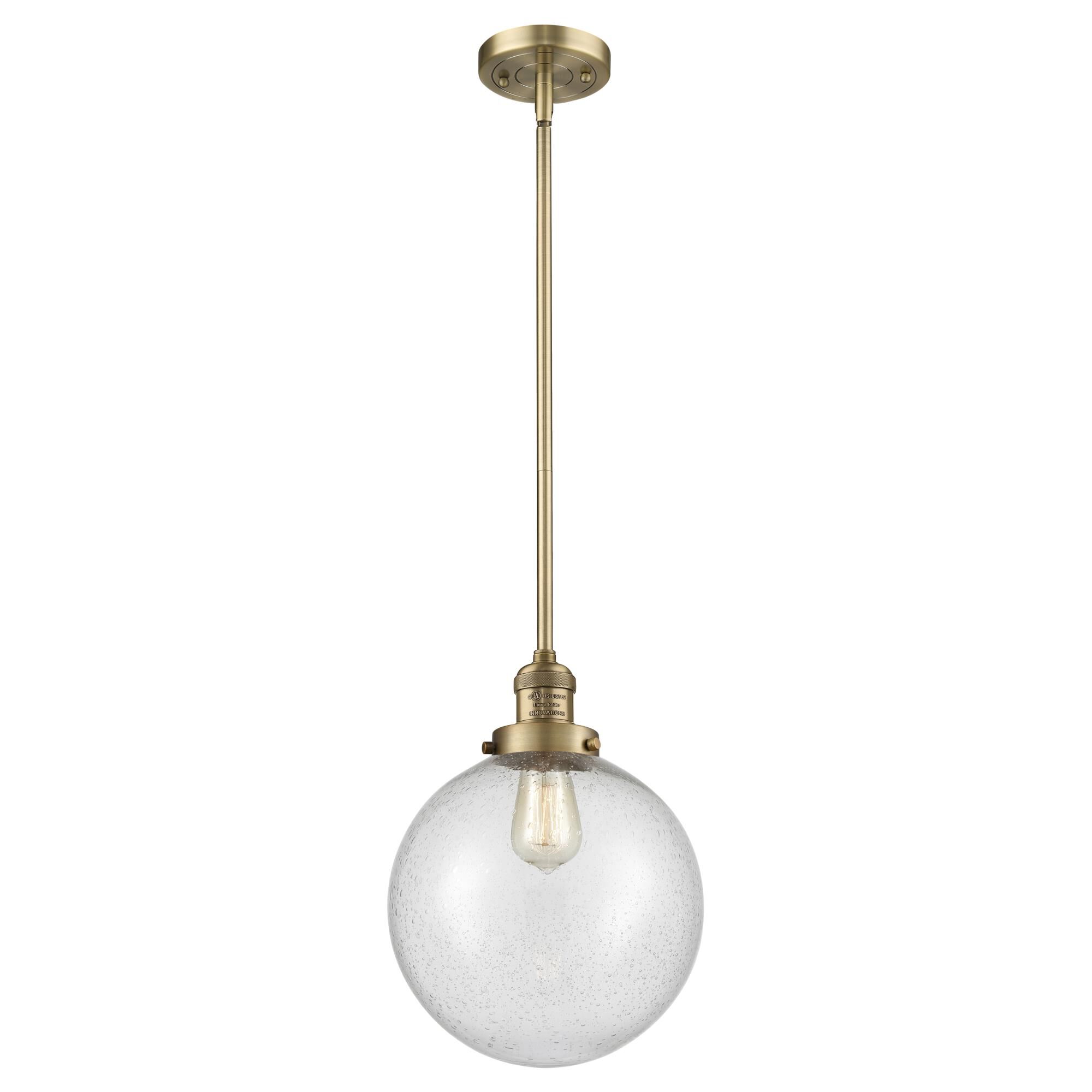 Shown in Brushed Brass finish and Seedy glass