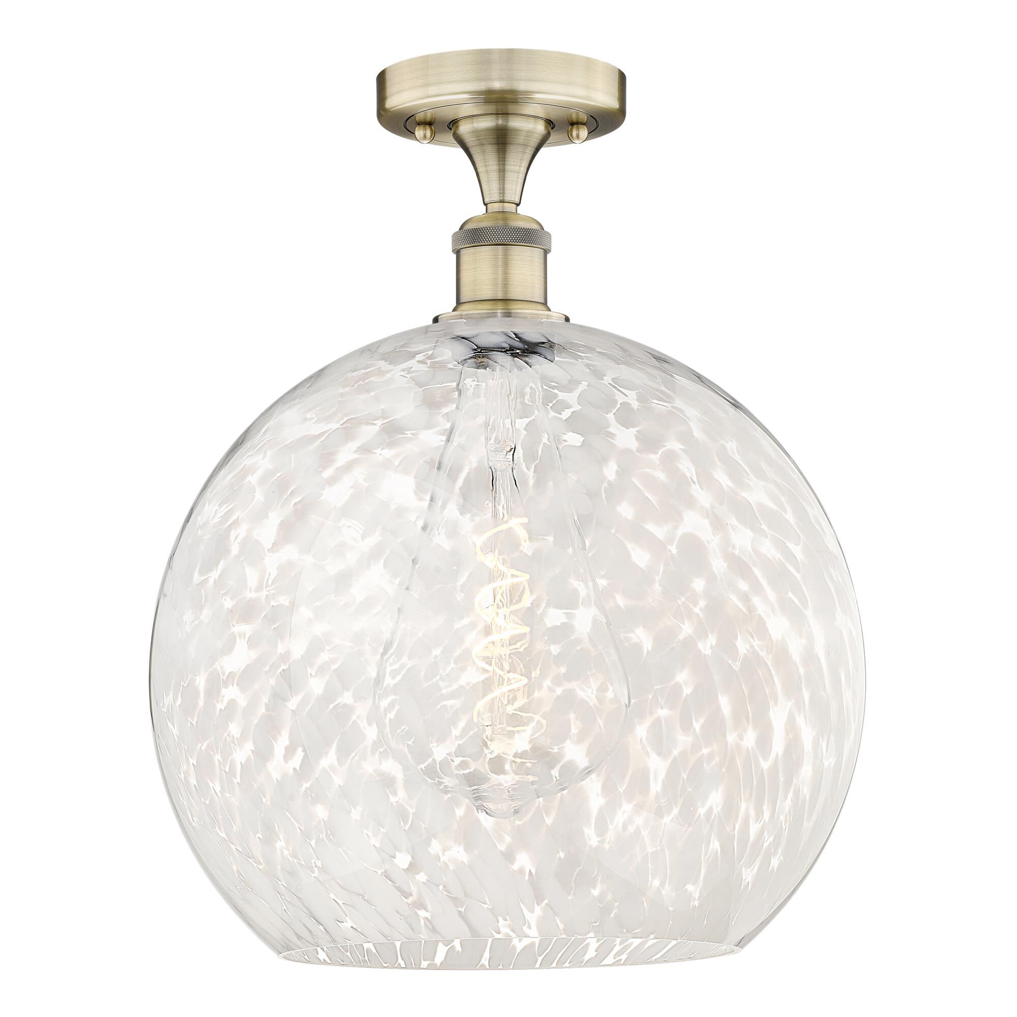 Shown in Antique Brass finish and White Mouchette glass