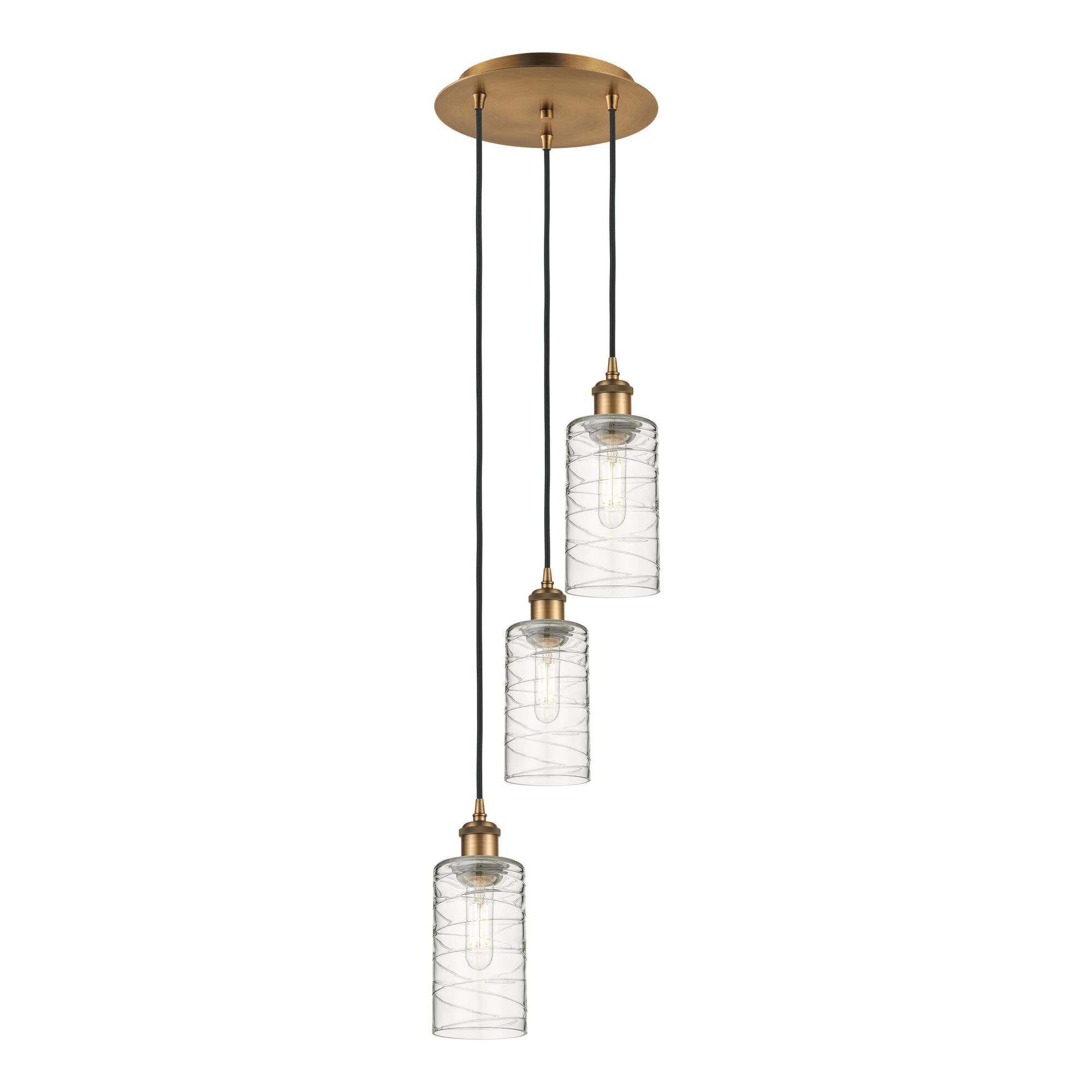 Shown in Brushed Brass finish and Deco Swirl shade