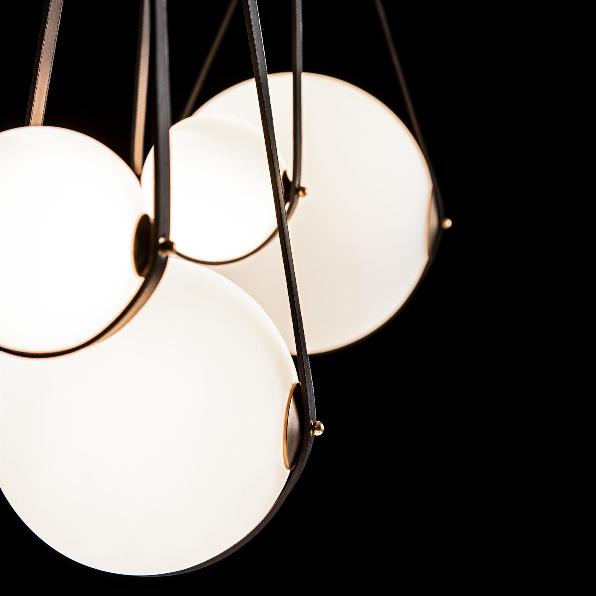 Shown in Black finish and Opal glass and Antique Brass accent