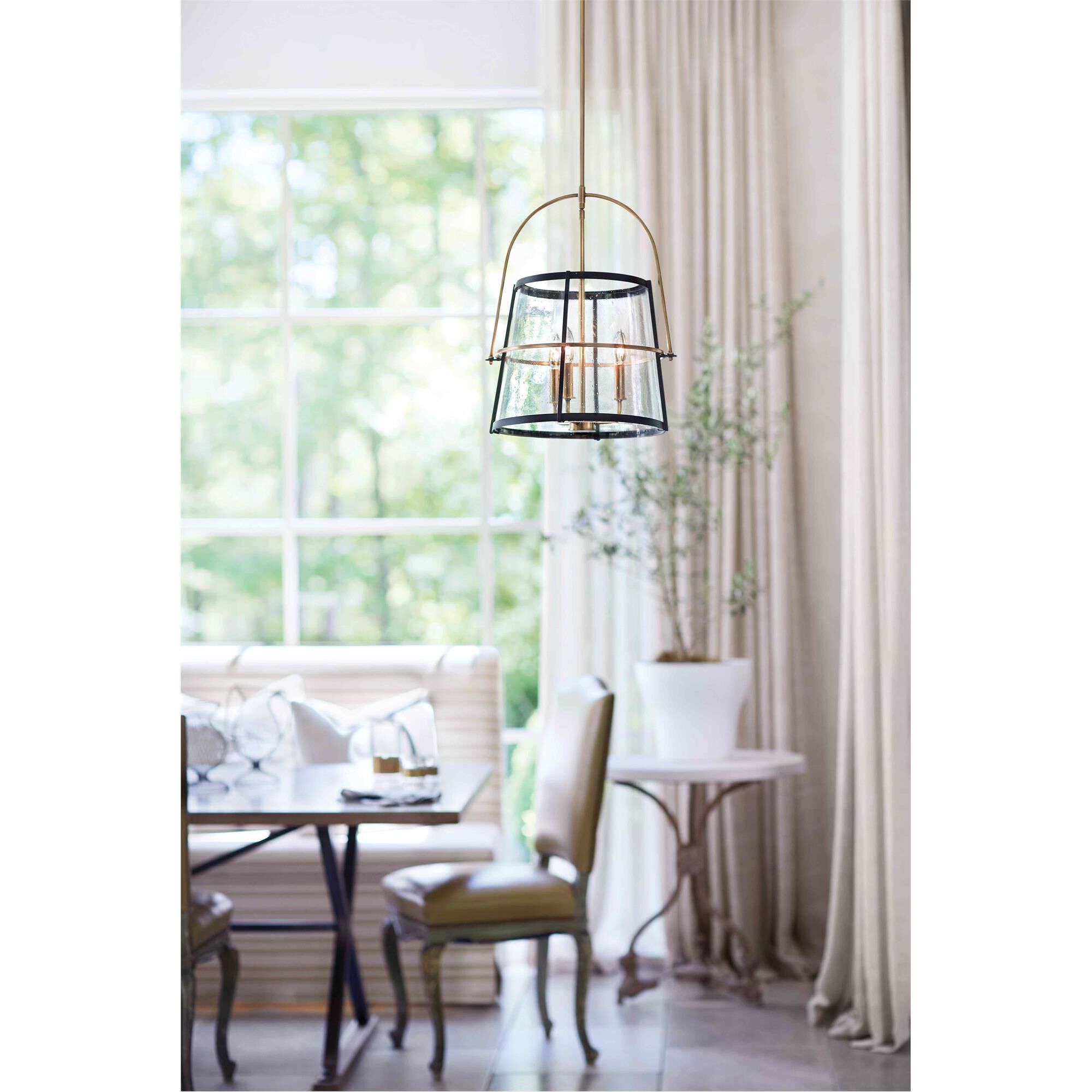 Shown in Heritage Brass finish and Clear Seedy glass and Black accent