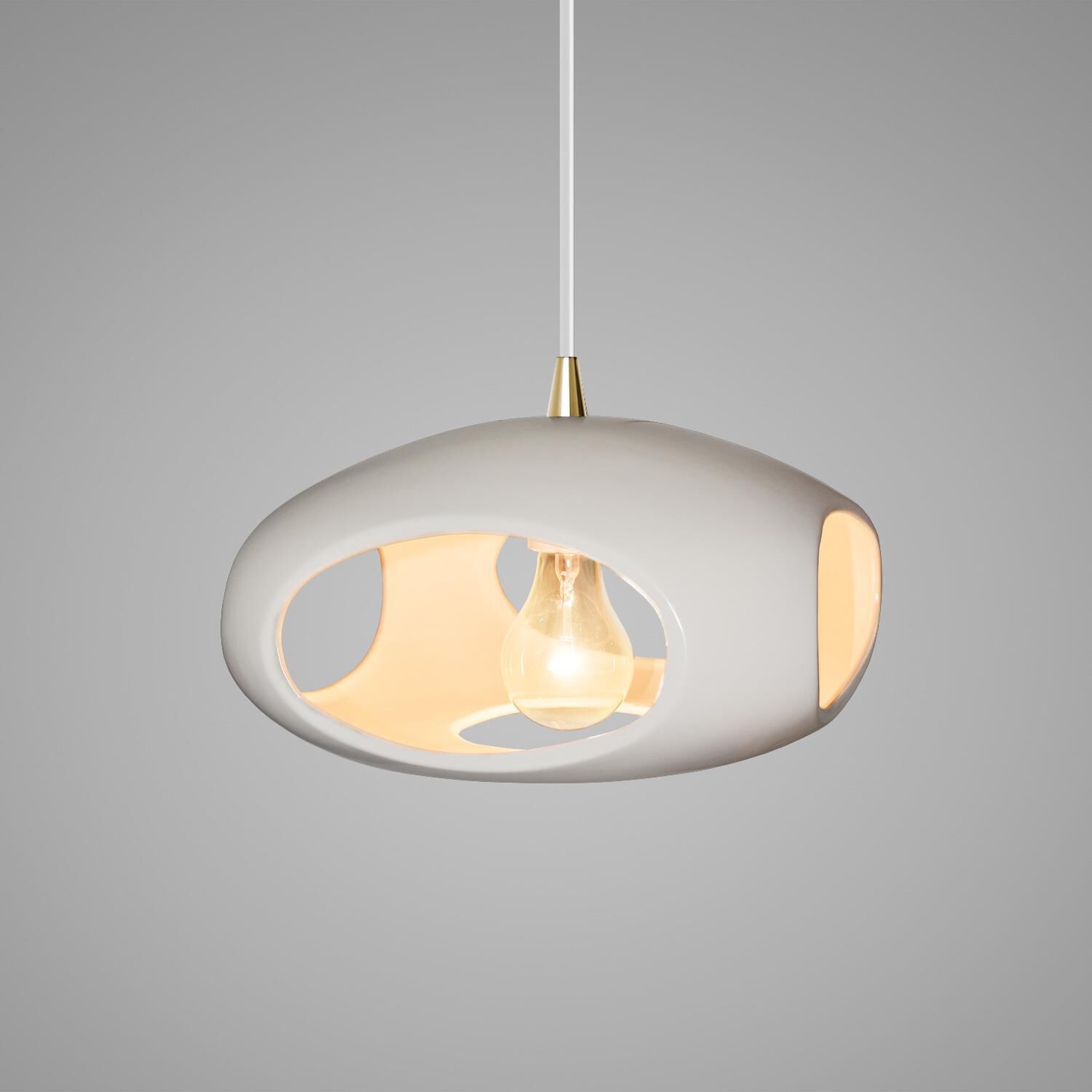 Shown in Antique Brass finish and Matte White Ceramic shade