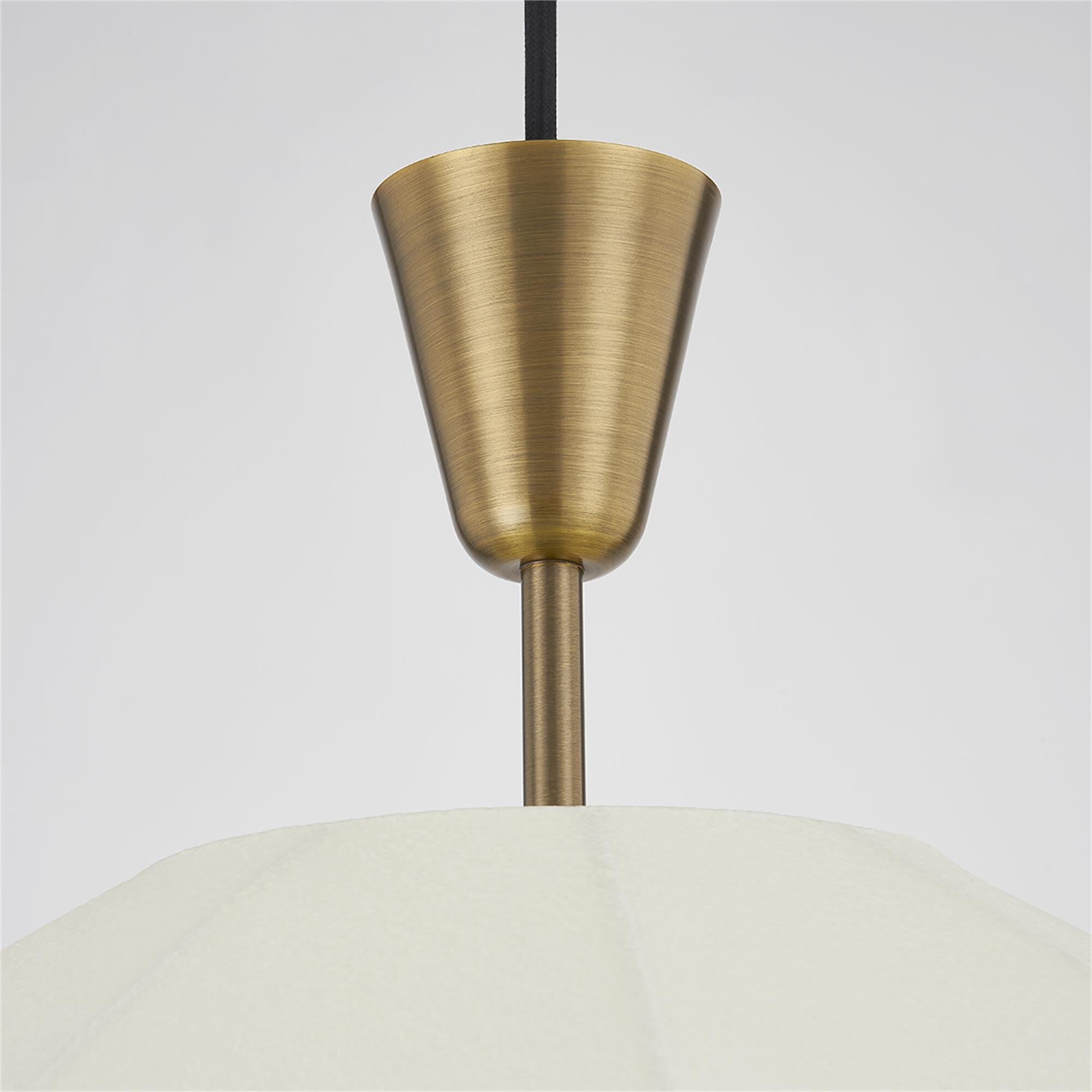 Shown in Patina Brass finish and Cream shade