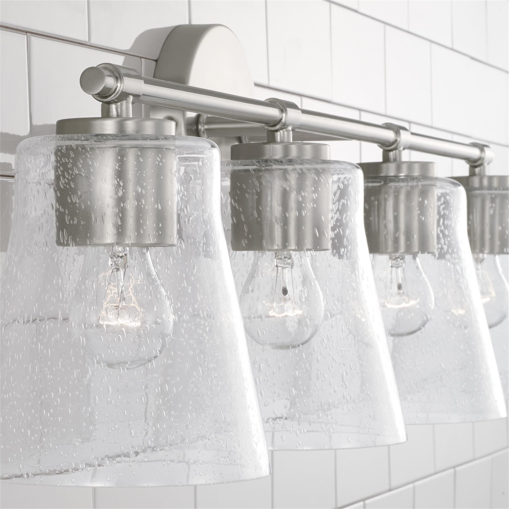 Shown in Brushed Nickel finish and Clear Seeded glass