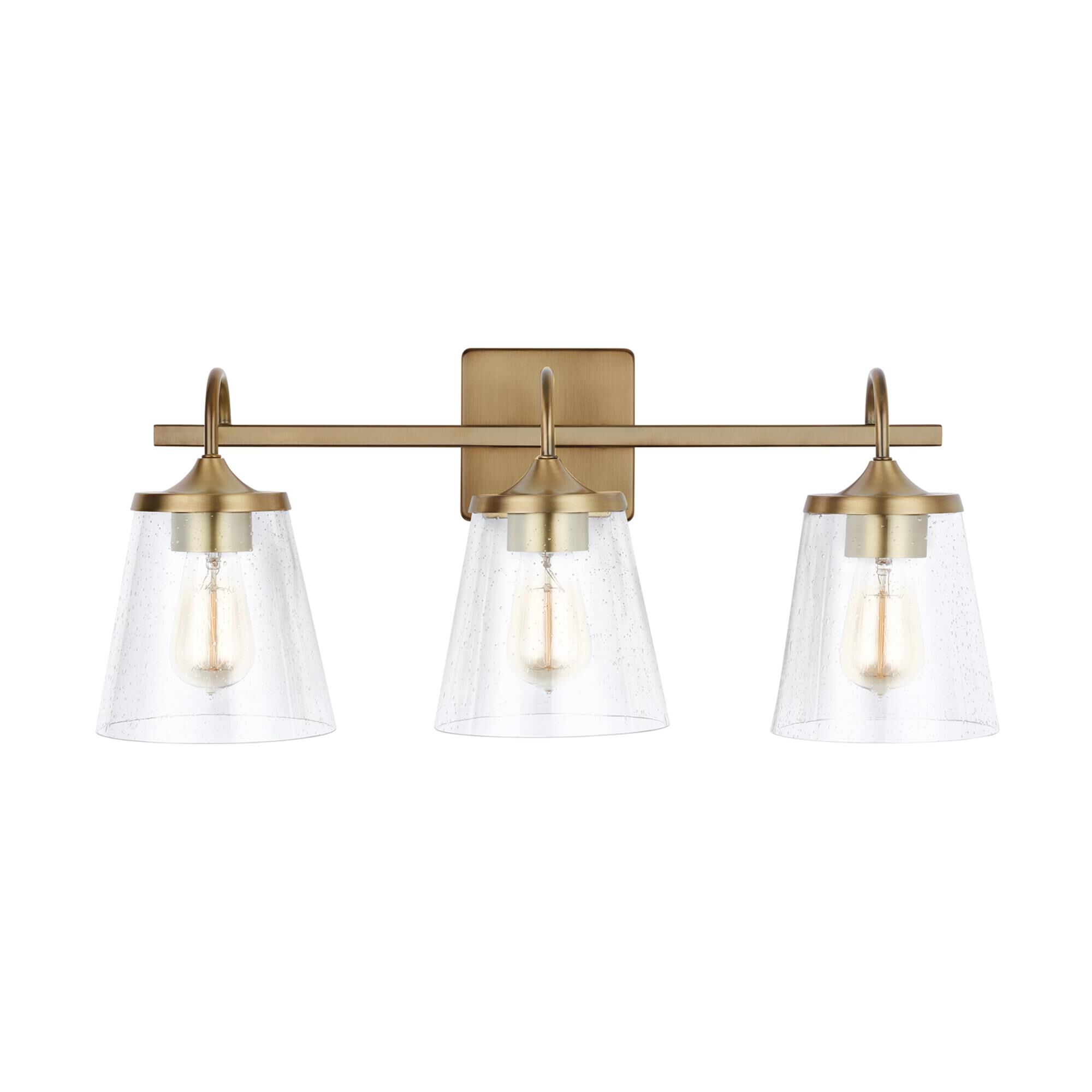 Shown in Aged Brass finish and Clear Seeded glass