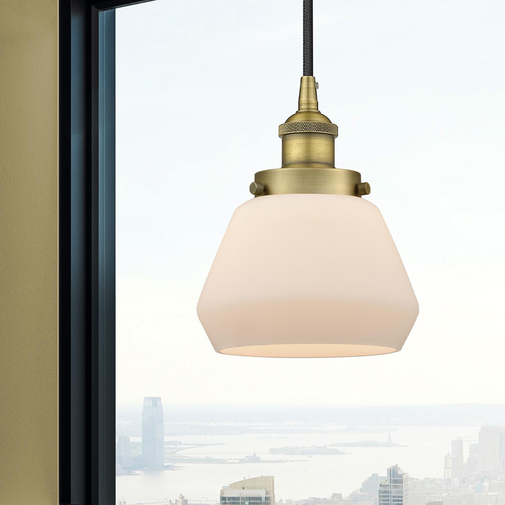 Shown in Brushed Brass finish and Matte White glass