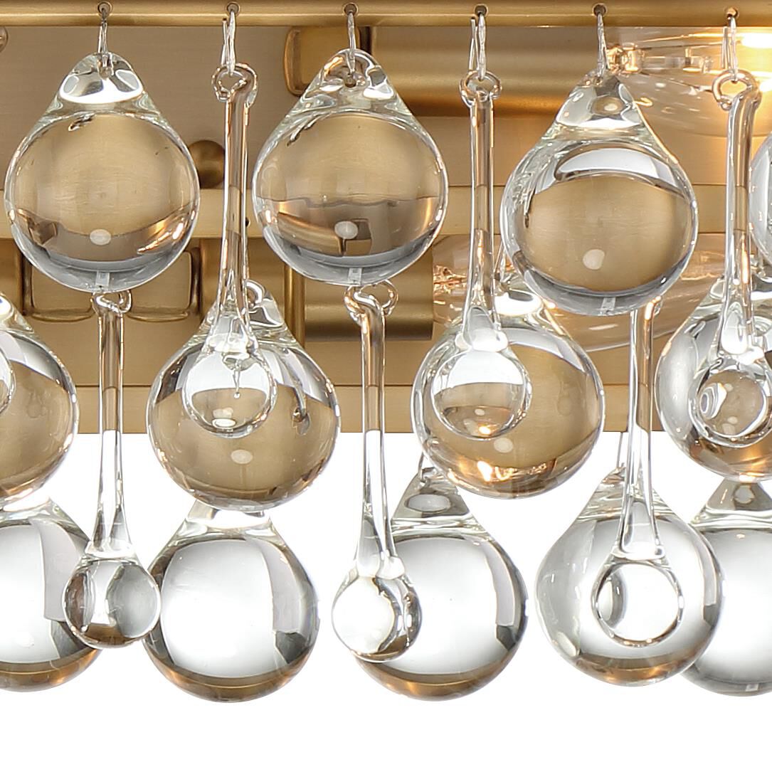 Shown in Vibrant Gold finish and Clear Glass Drops crystal