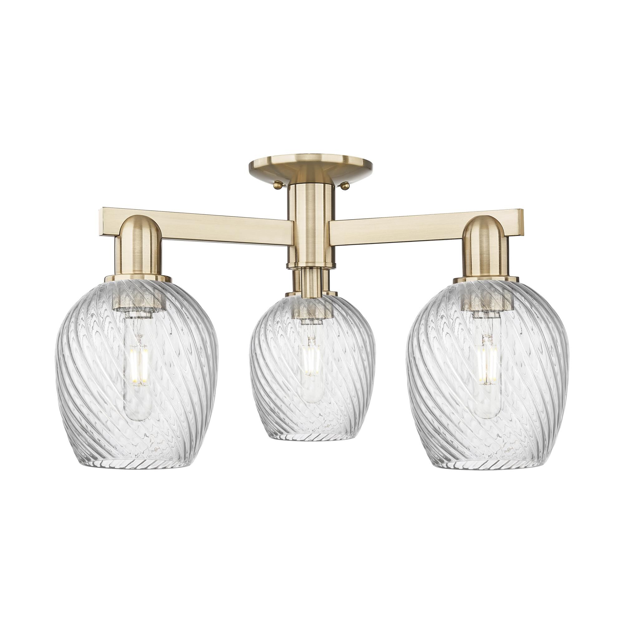 Shown in Champagne Bronze finish and Clear Spiral Fluted glass