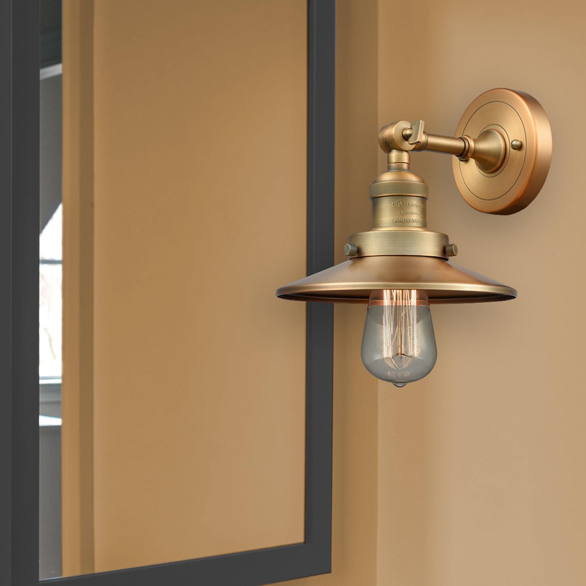 Shown in Brushed Brass finish and Brushed Brass shade