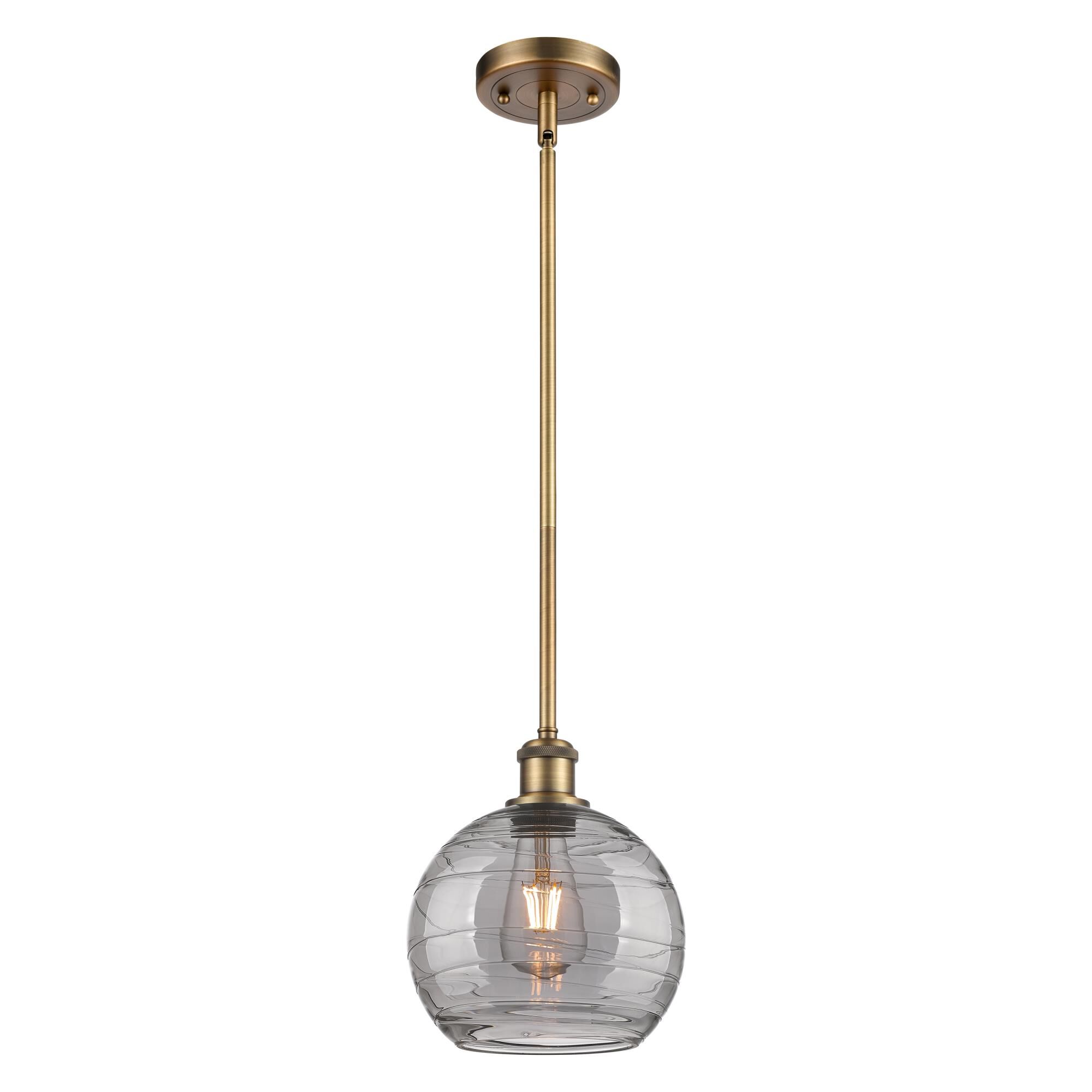 Shown in Brushed Brass finish and Light Smoke Deco Swirl glass