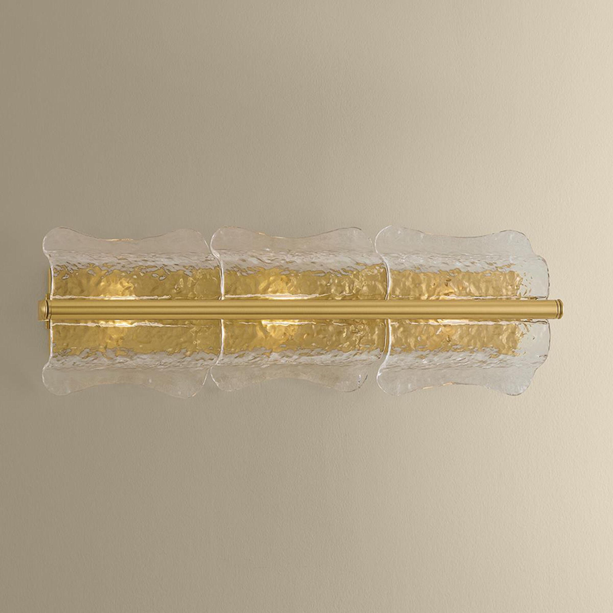 Shown in Aged Brass finish and Clear Optic glass