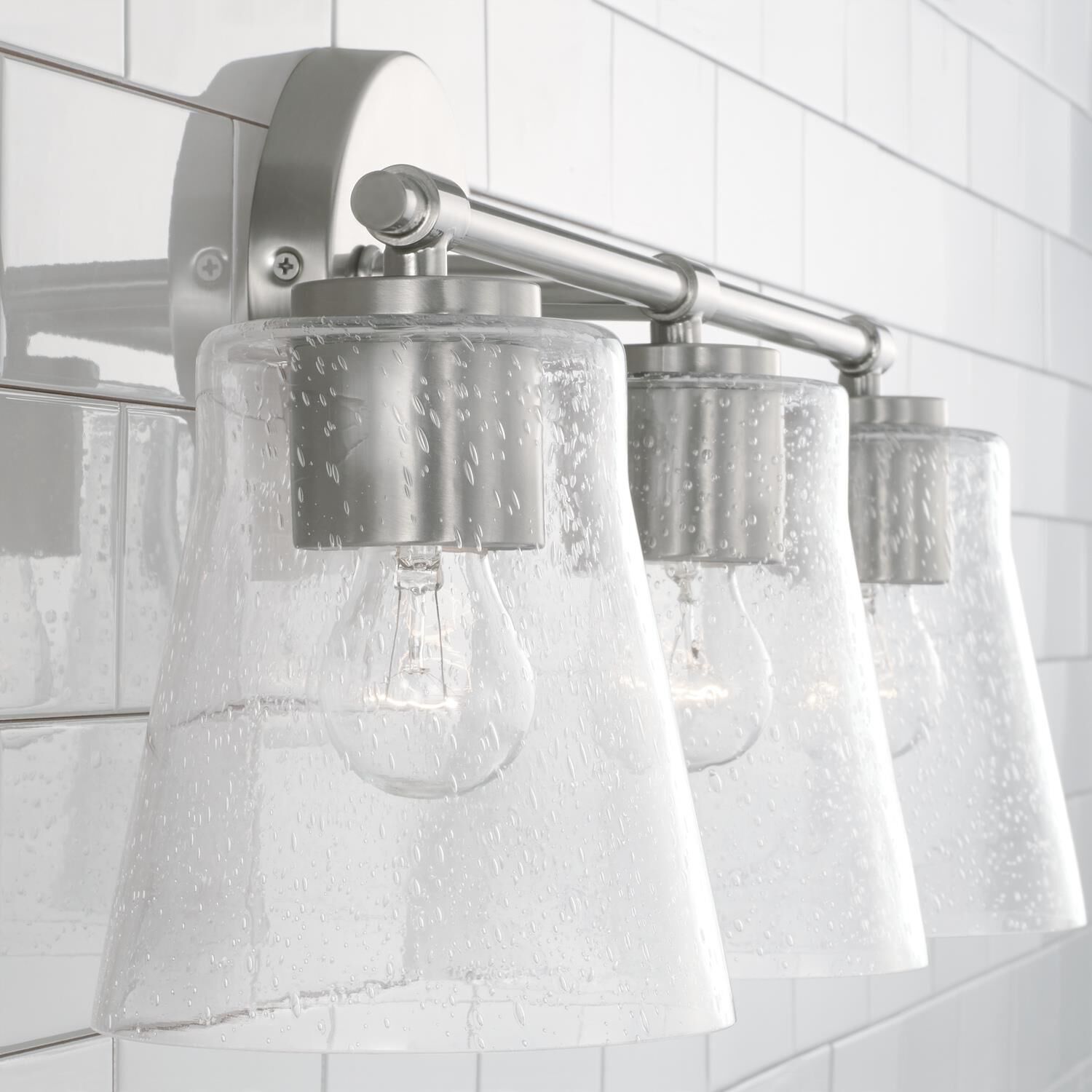 Shown in Brushed Nickel finish and Clear Seeded glass