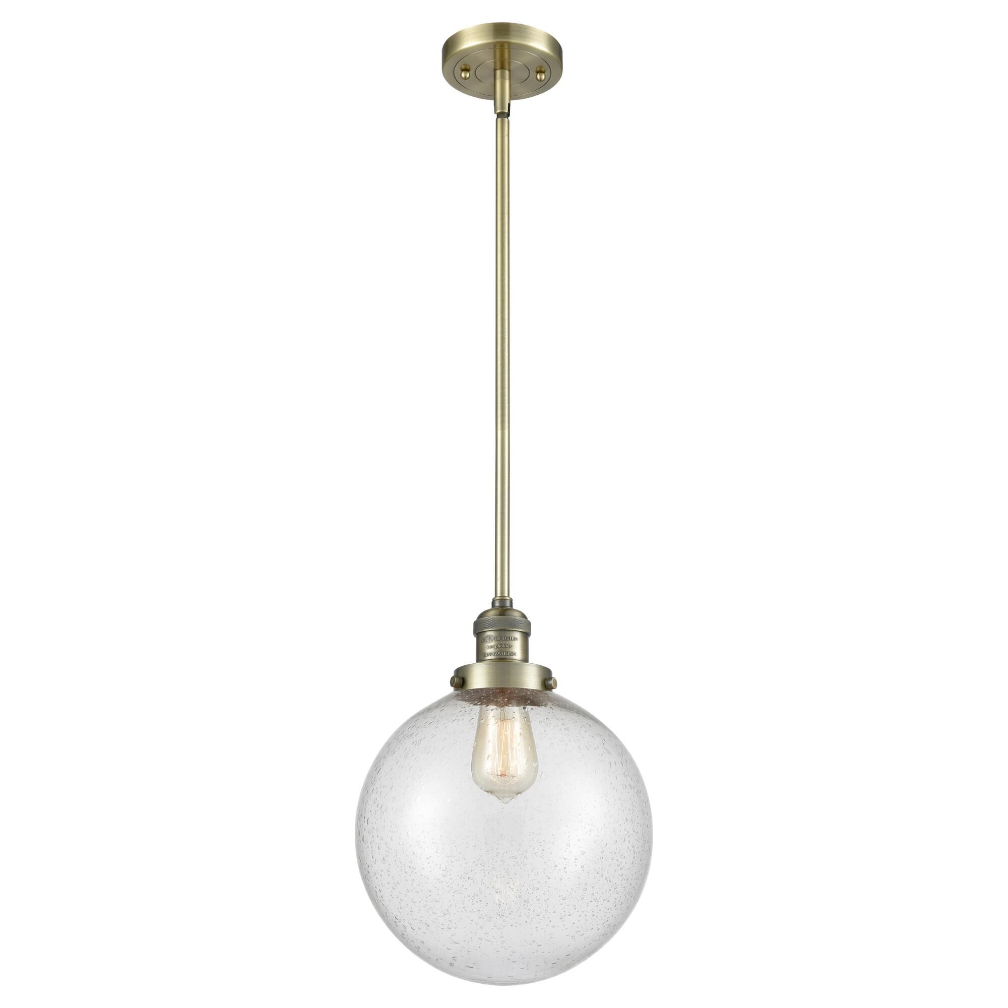 Shown in Antique Brass finish and Seedy glass