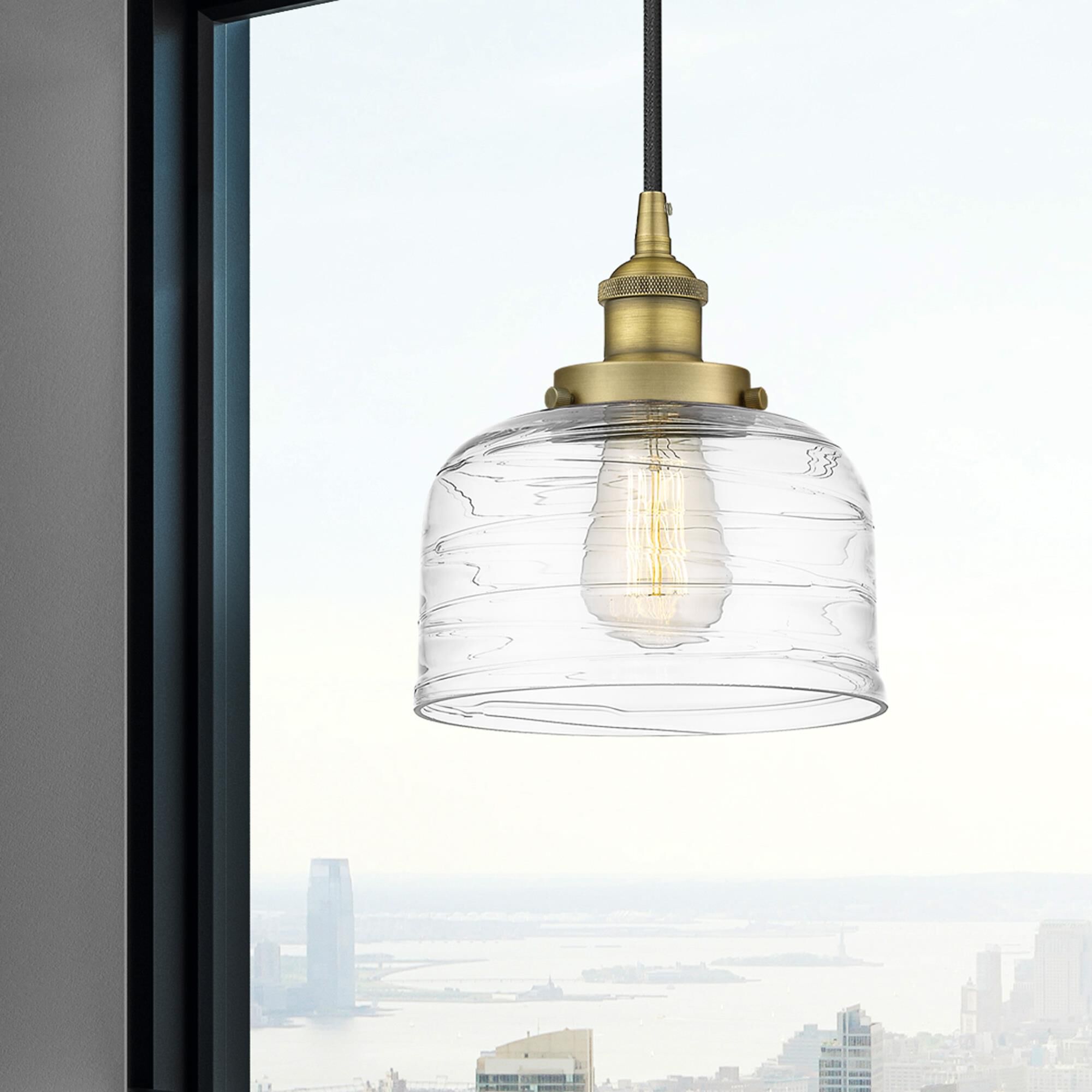 Shown in Brushed Brass finish and Clear glass