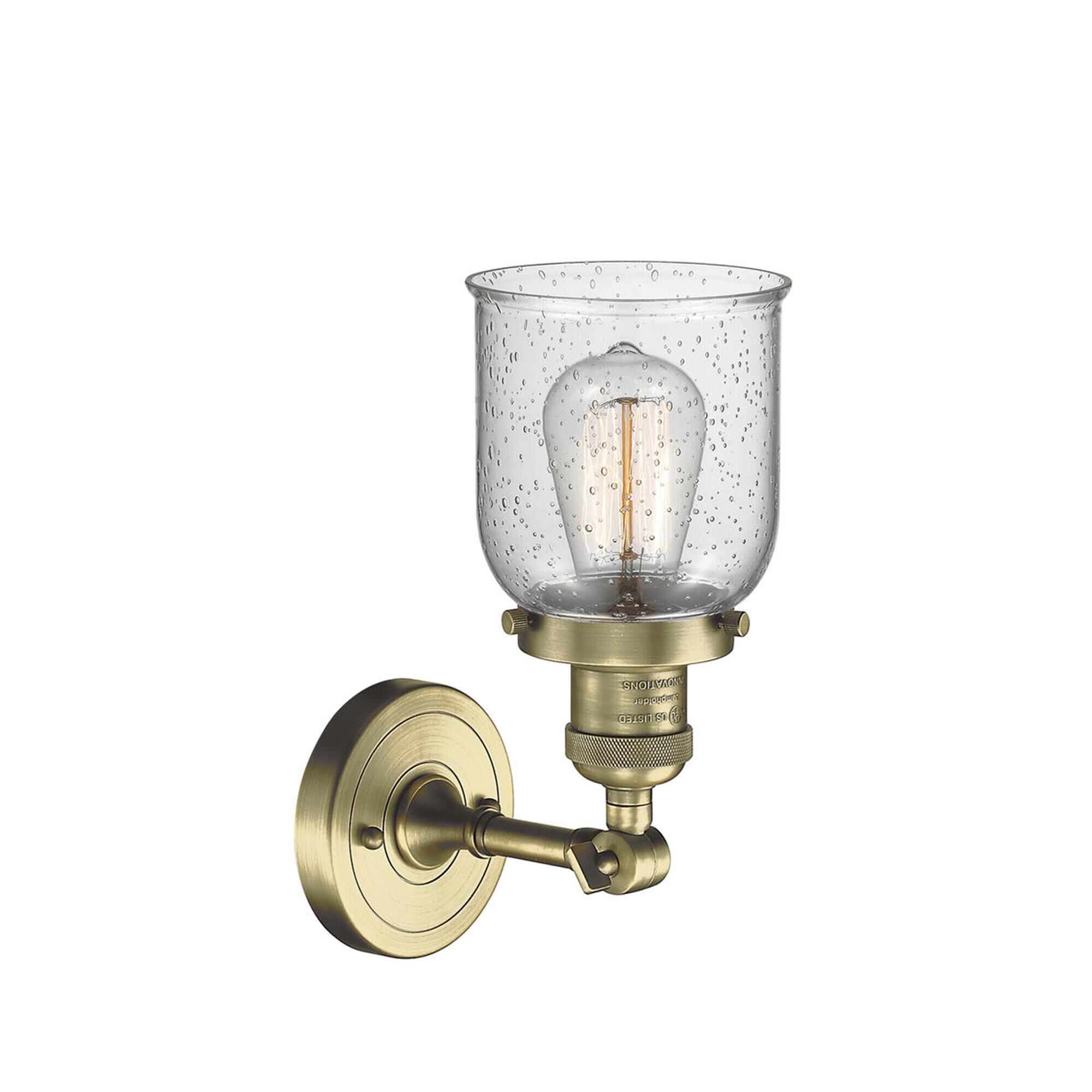 Shown in Antique Brass finish and Seedy glass