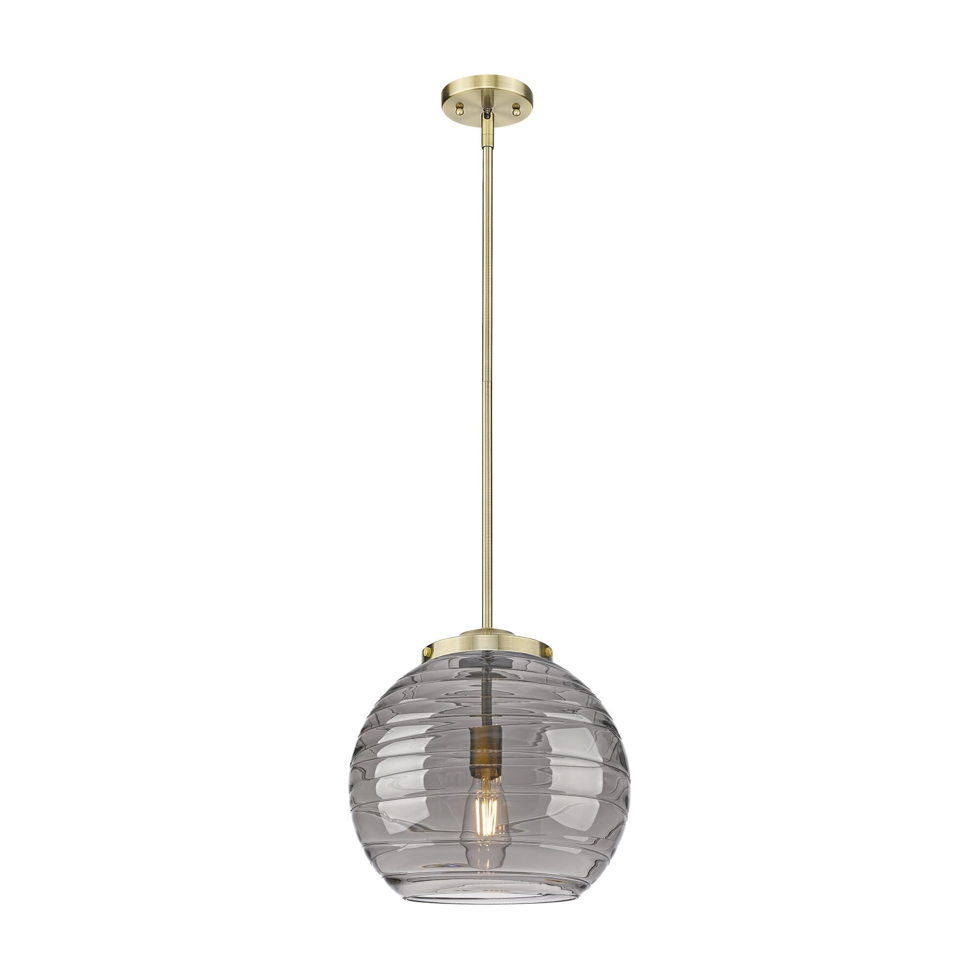 Shown in Antique Brass finish and Light Smoke Deco Swirl glass