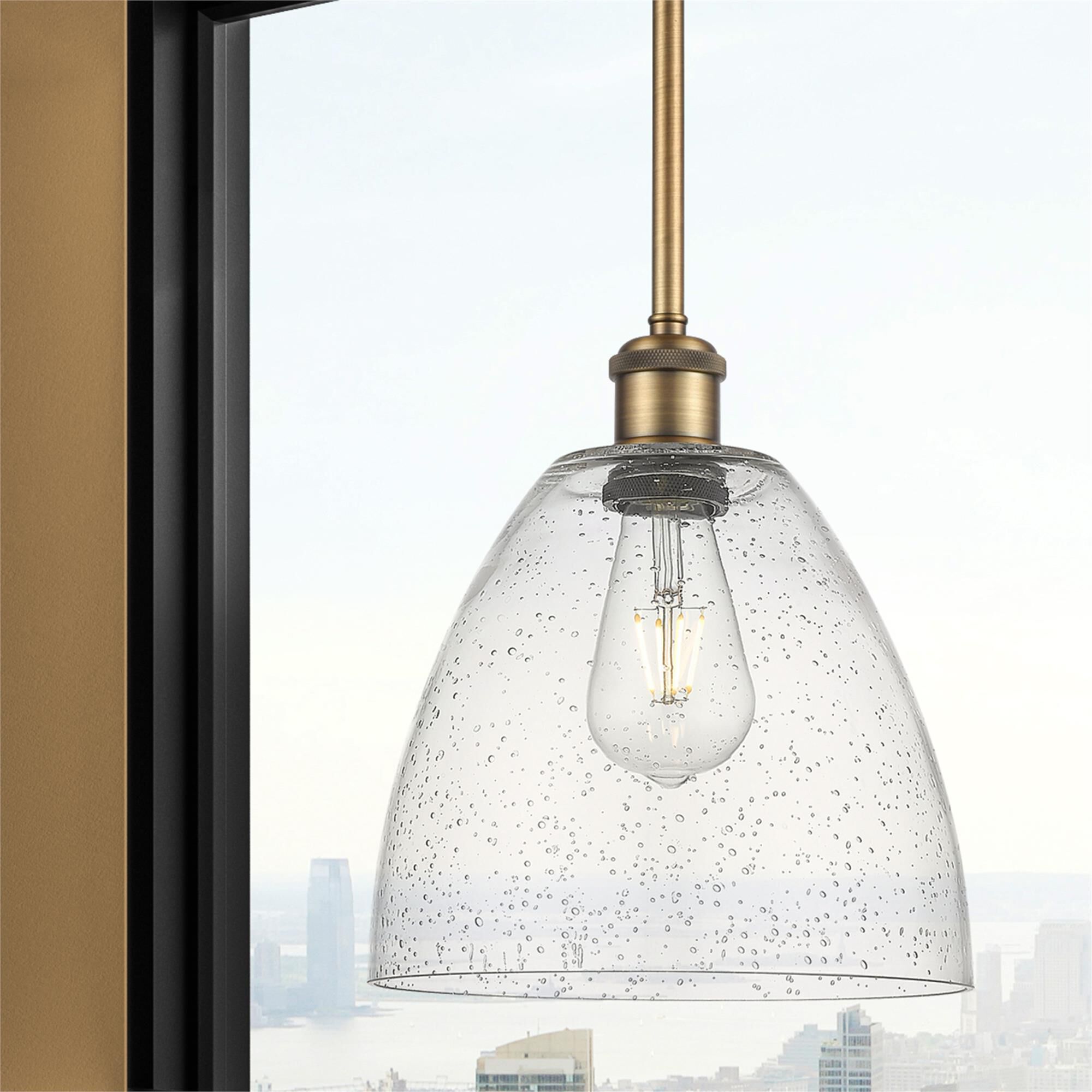 Shown in Brushed Brass finish and Seedy glass