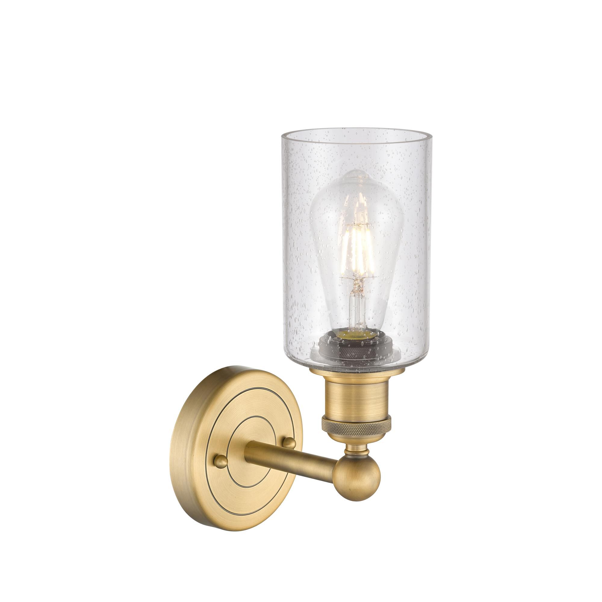 Shown in Brushed Brass finish and Seedy glass