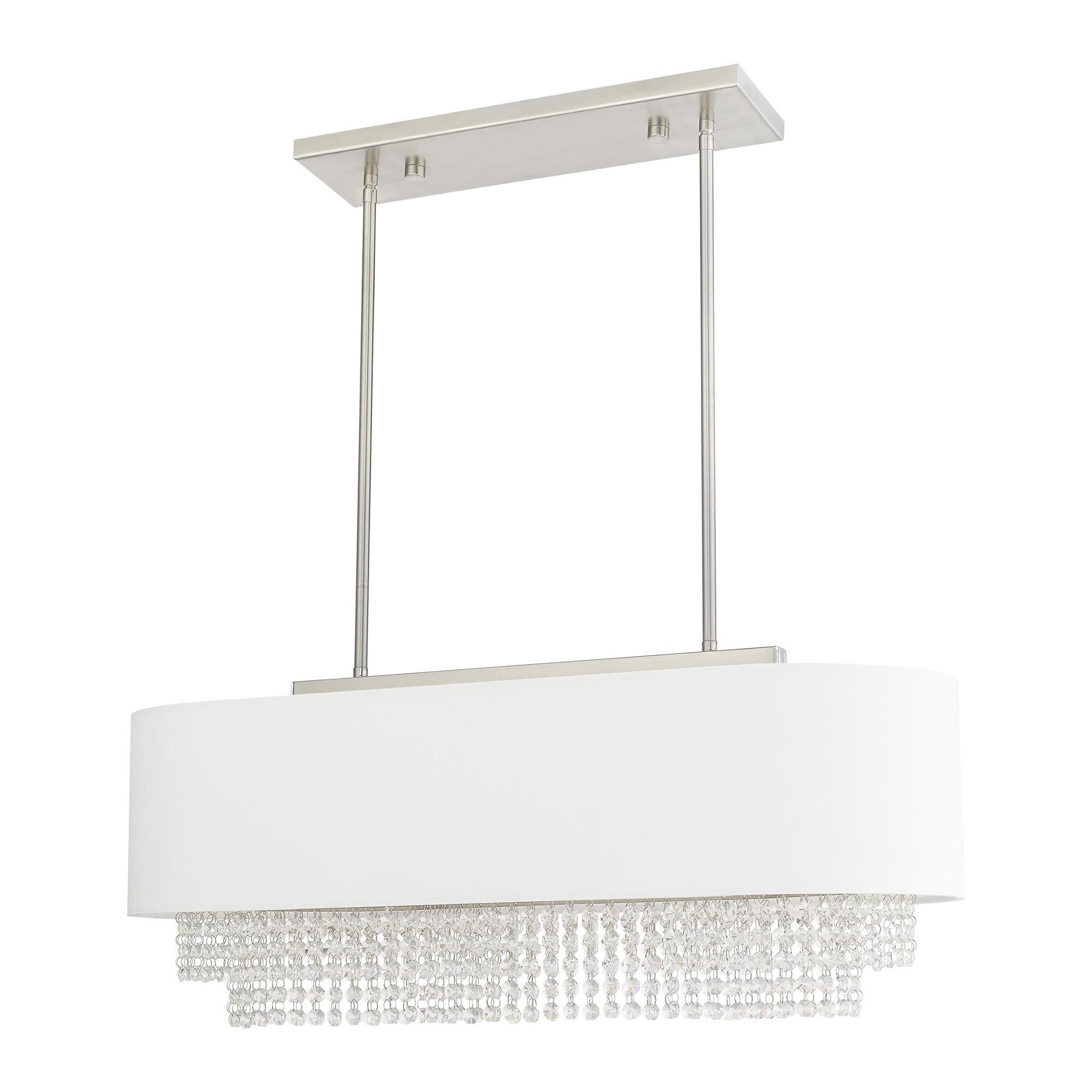 Shown in Brushed Nickel finish and Clear Crystals with Hand Crafted Off-White Fabric Hardback shade