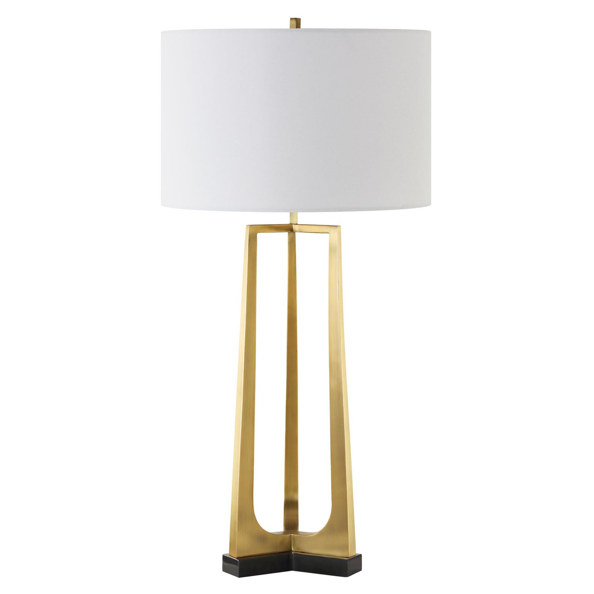 Shown in This Table Lamp Features A Sleek Iron Base With Three Tapered Legs Finished In Plated Antique Brass, finish and Round Drum Hardback shade