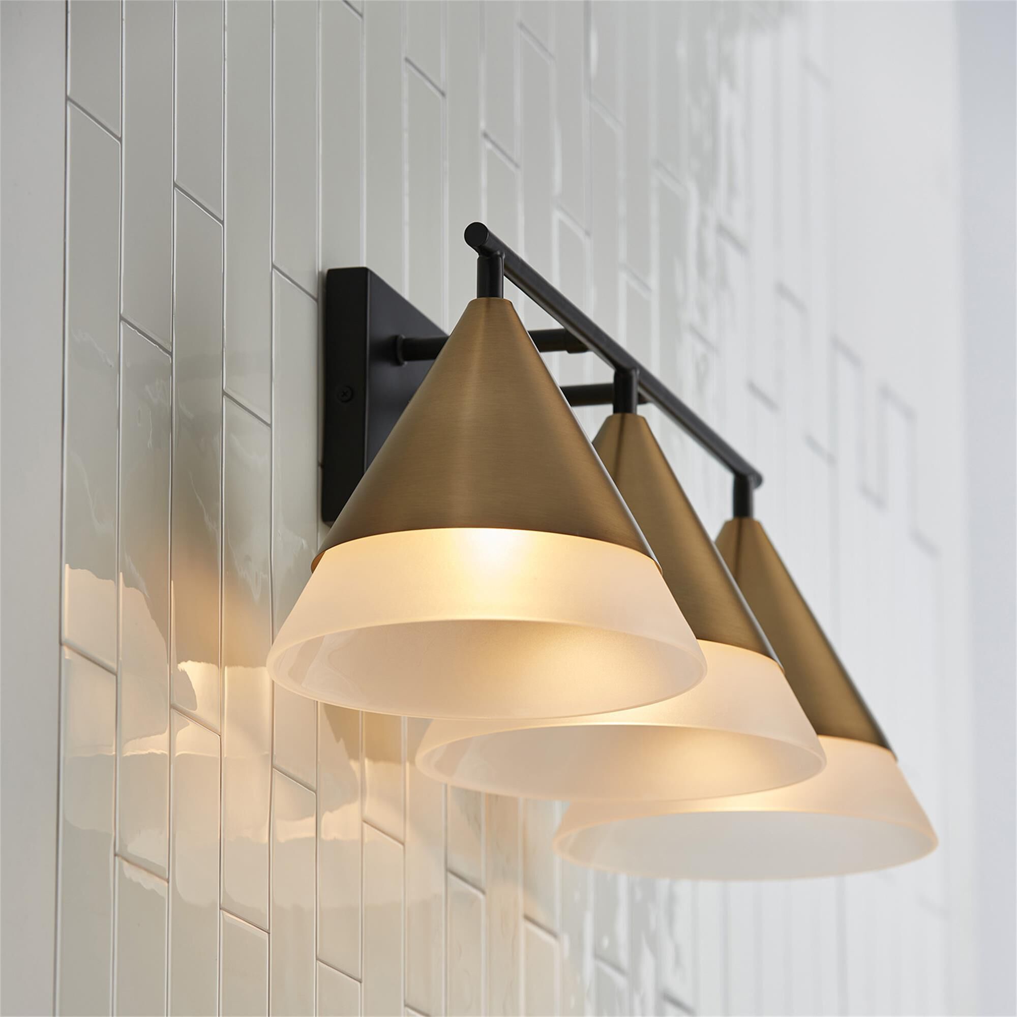 Shown in Aged Brass and Black finish and Frosted glass
