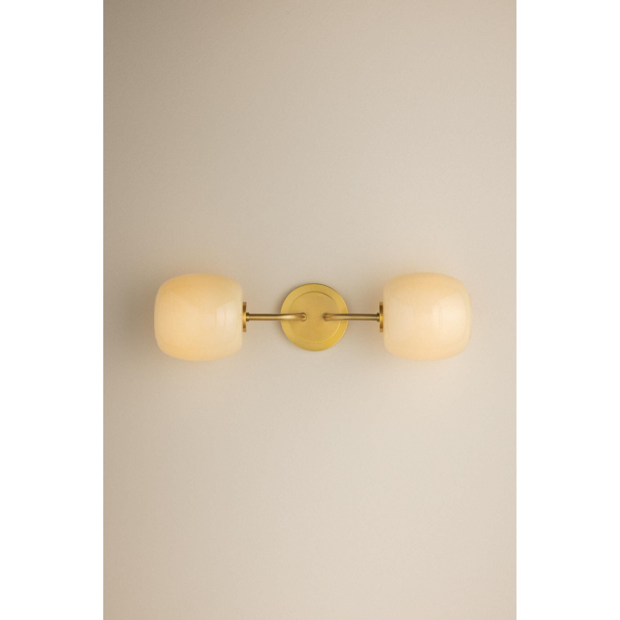 Shown in Aged Brass finish and Cream Opal glass