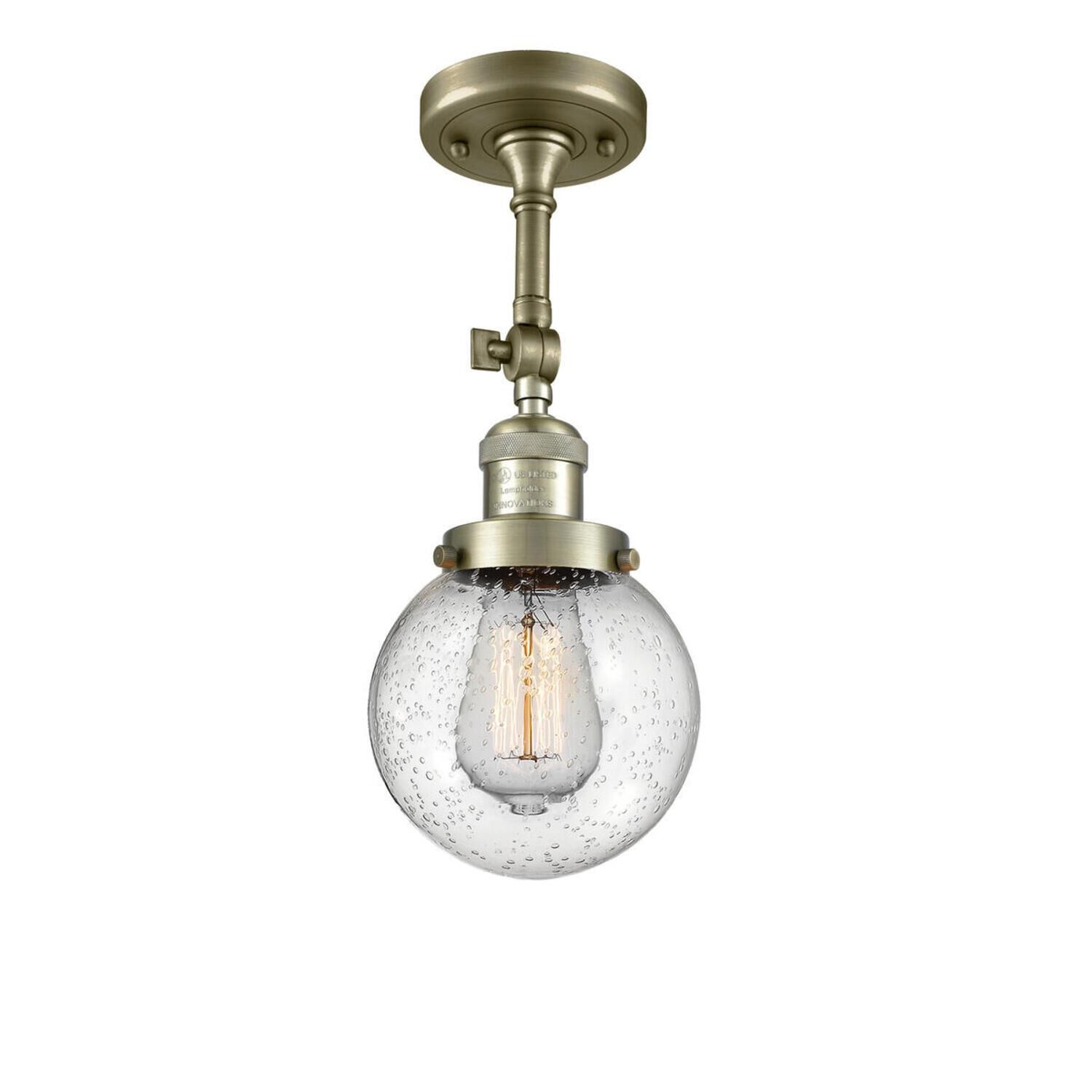 Shown in Antique Brass finish and Seedy glass and No Accent accent