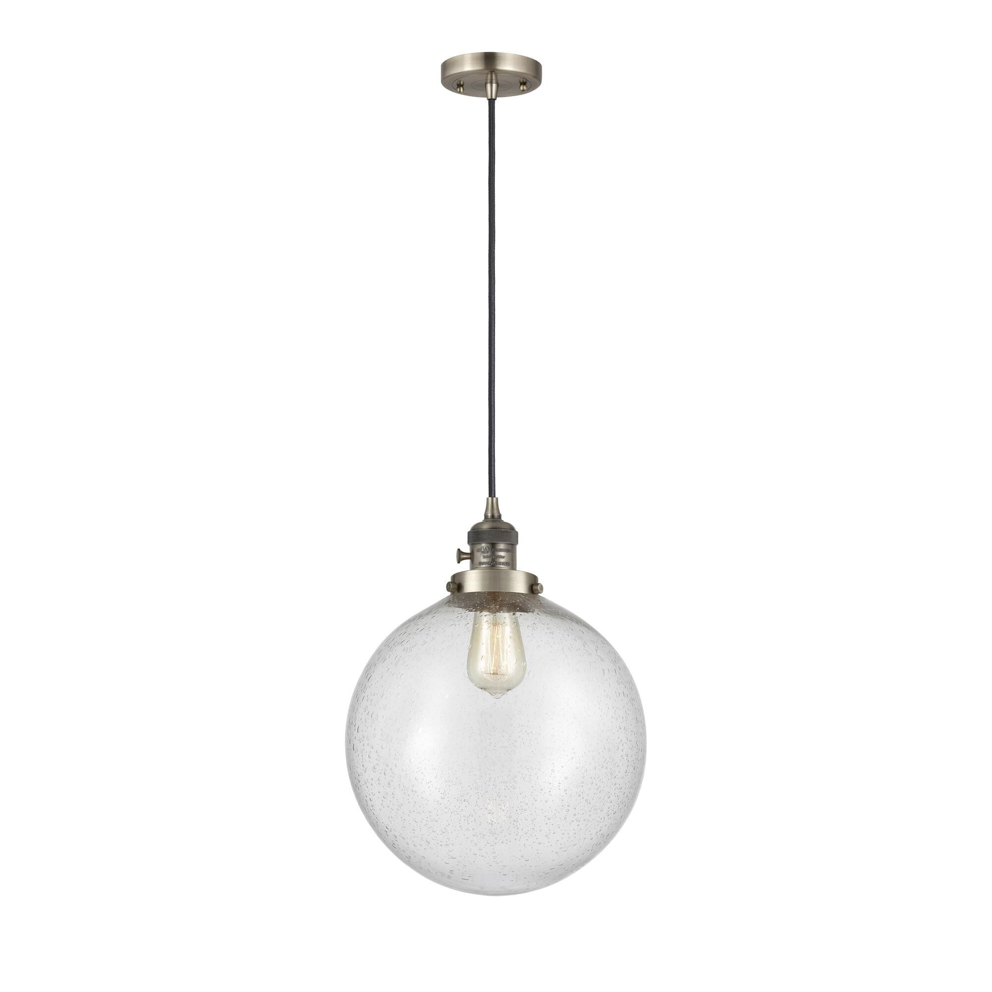 Shown in Antique Brass finish and Seedy glass